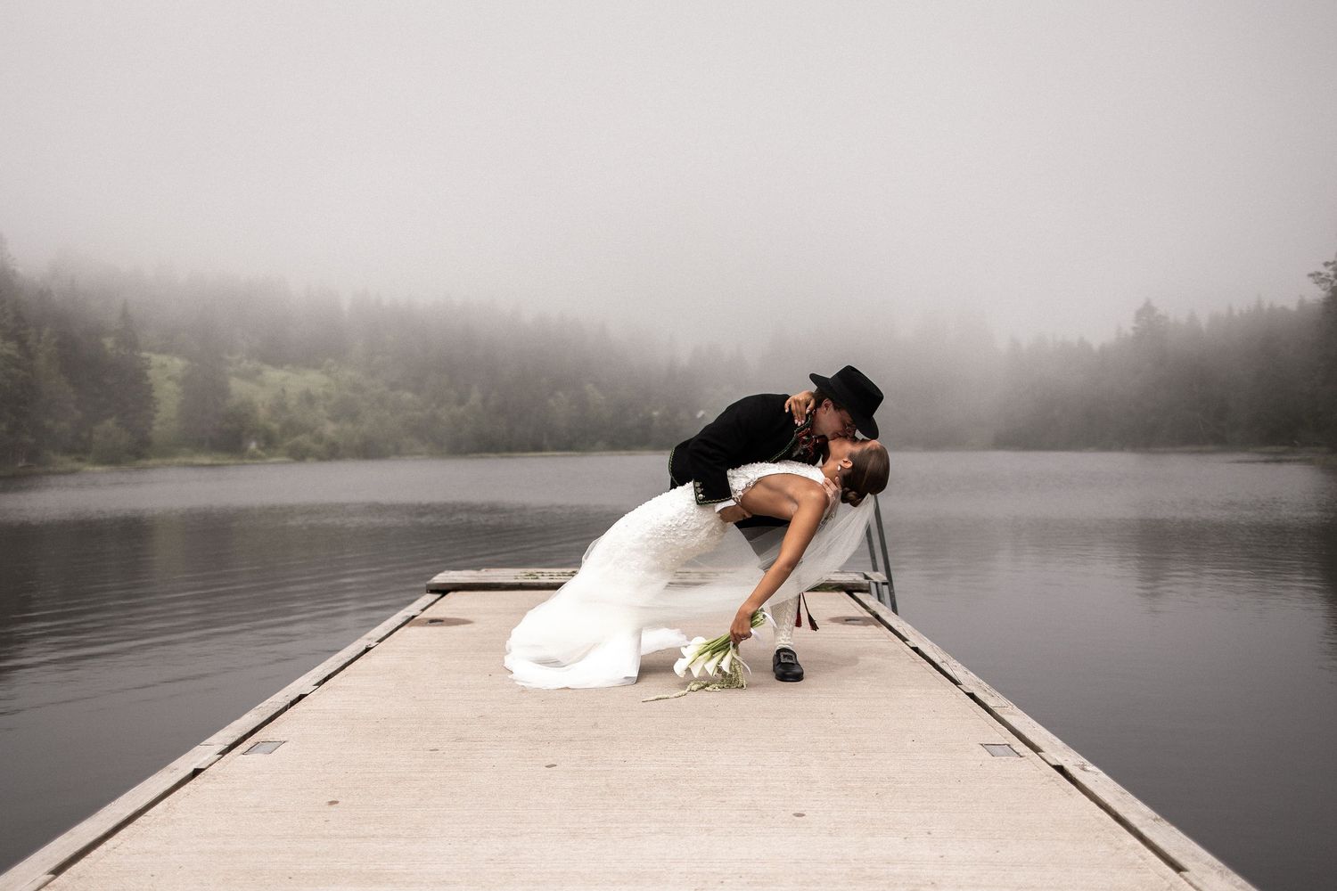 Wedding couple captured in a magical foggy environment.