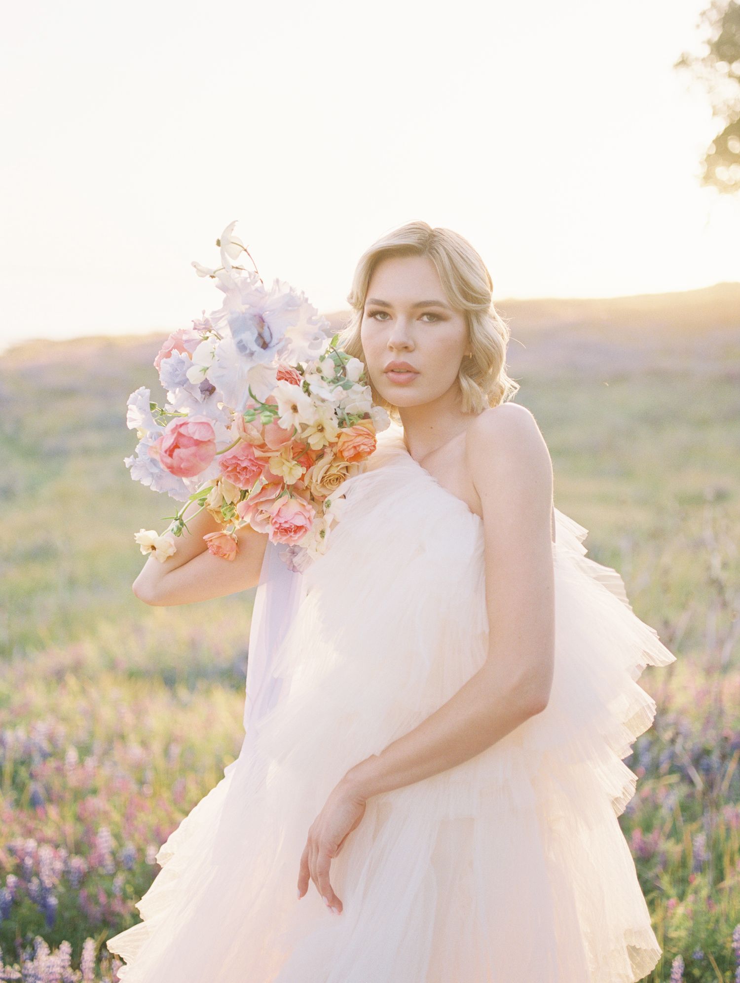 Editorial bridal close-up on 35mm film, soft focus and glowing natural light.