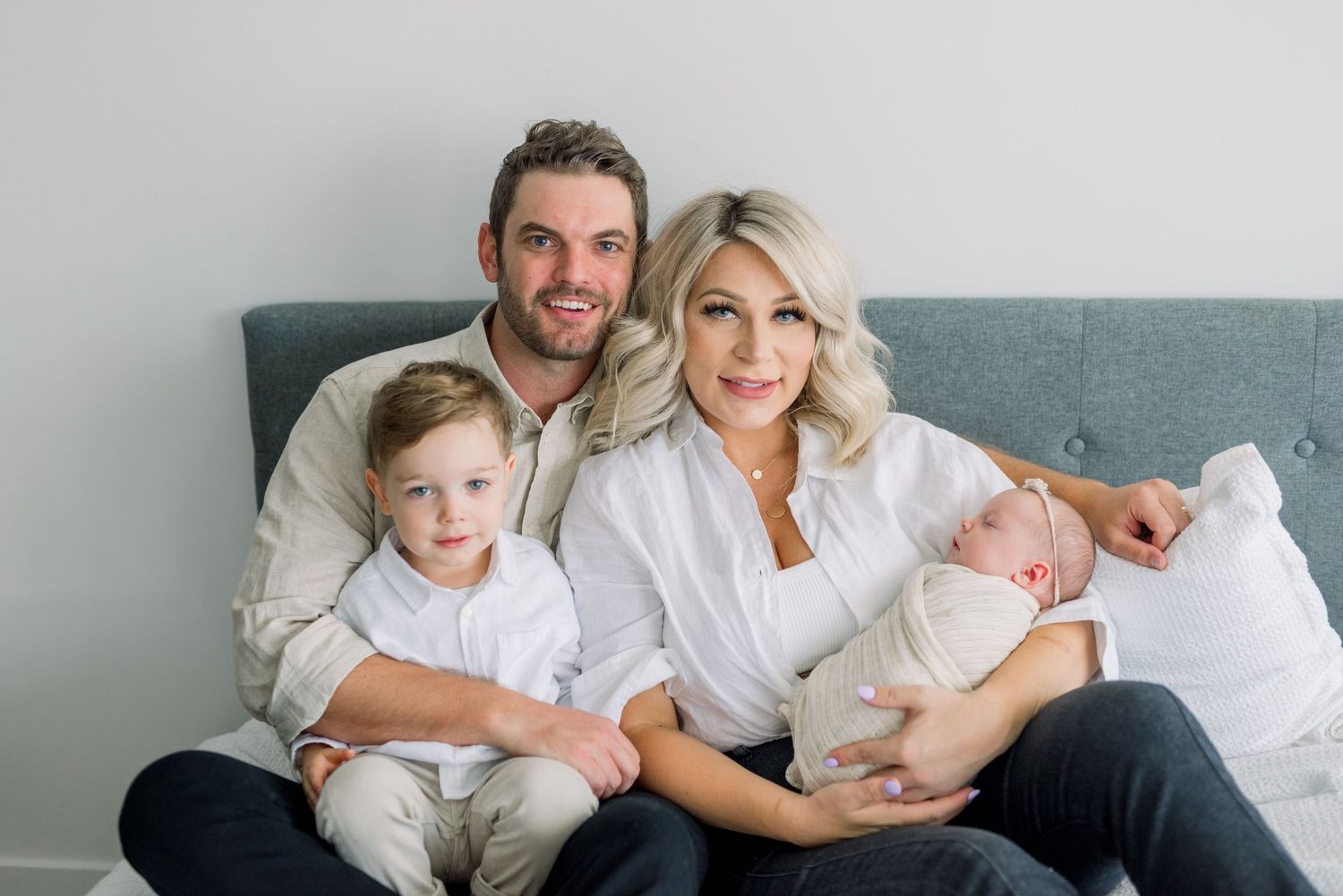family snuggling during newborn shoot in Boise Idaho