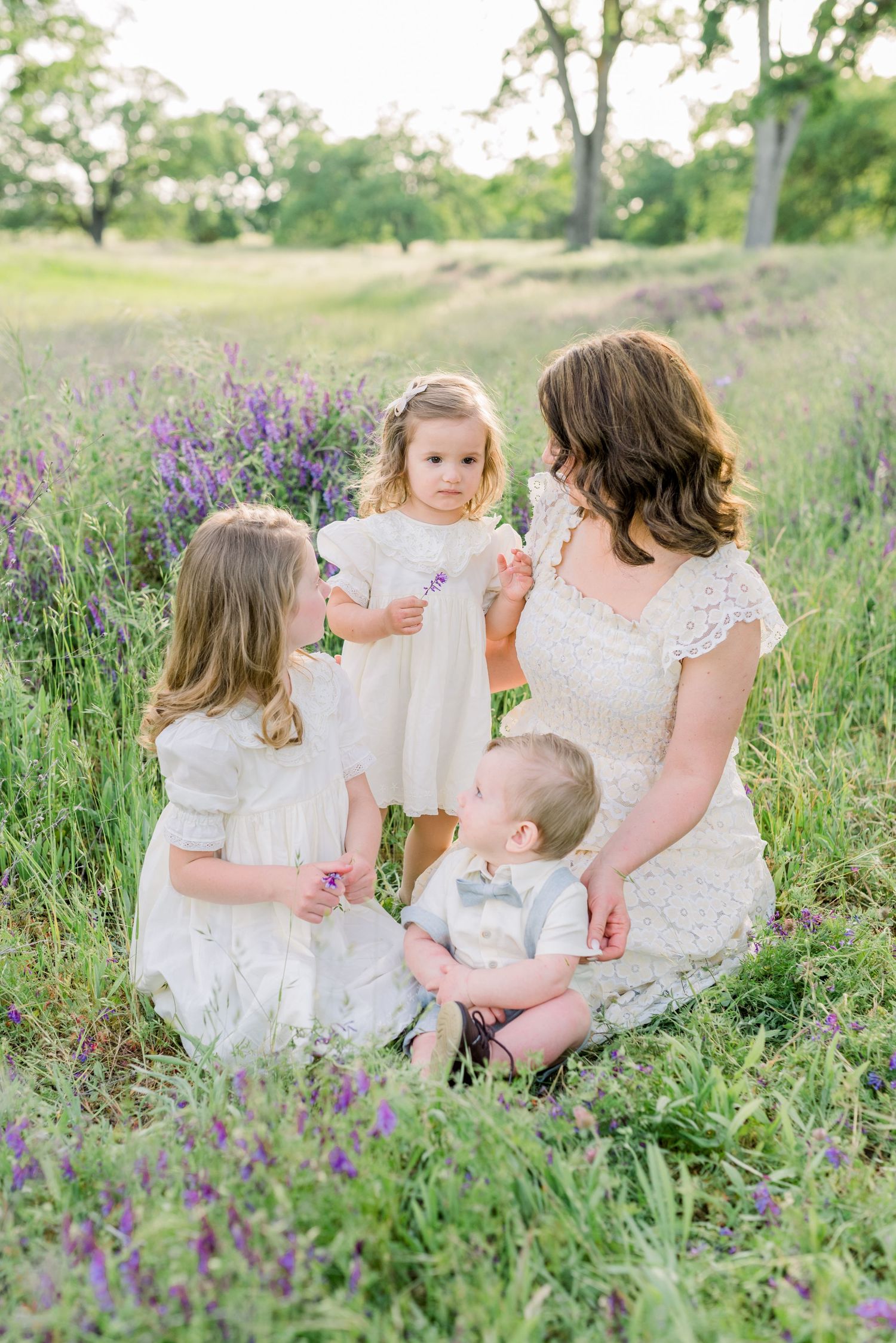 Outdoor lifestyle family photo in Boise with warm lighting and neutral outfits.