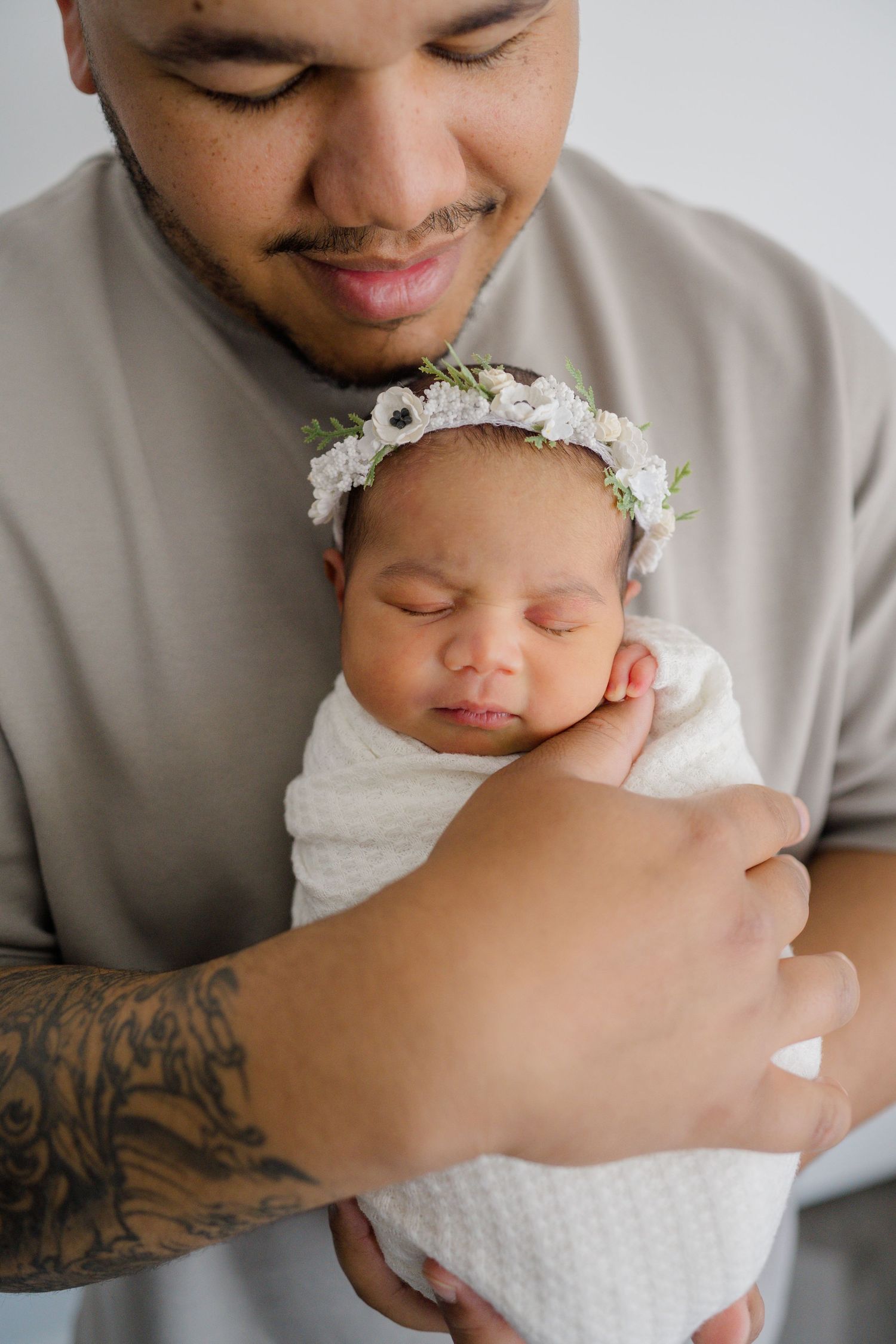 Father holding wrapped daughter in Boise Idaho