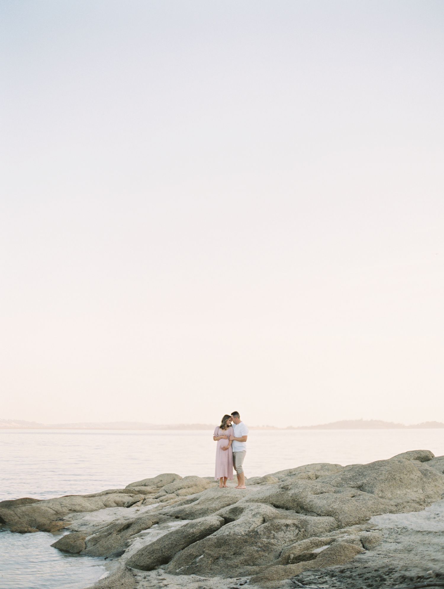 Outdoor lifestyle family photo in Boise with warm lighting and neutral outfits.