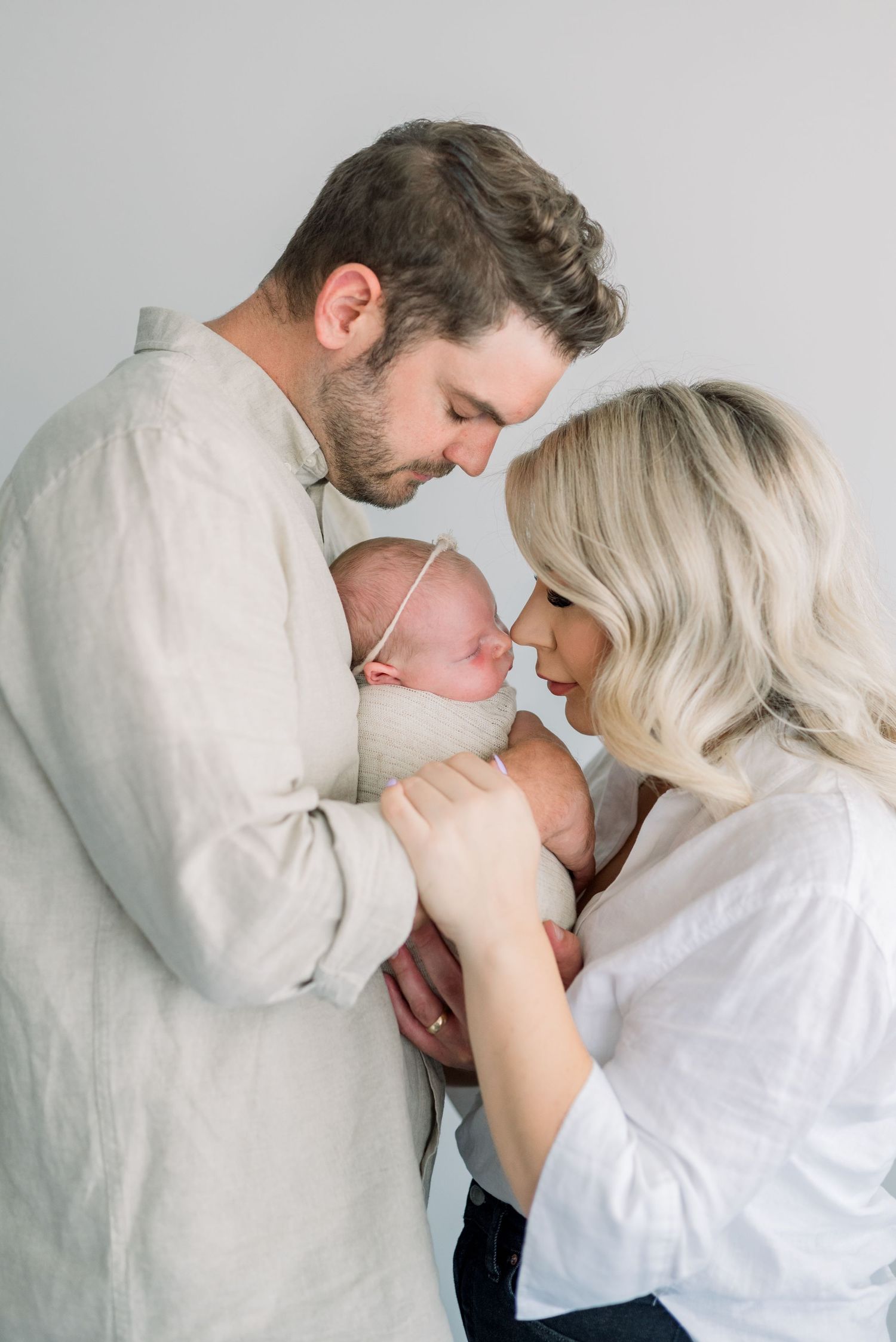 family snuggling during newborn shoot in Boise Idaho