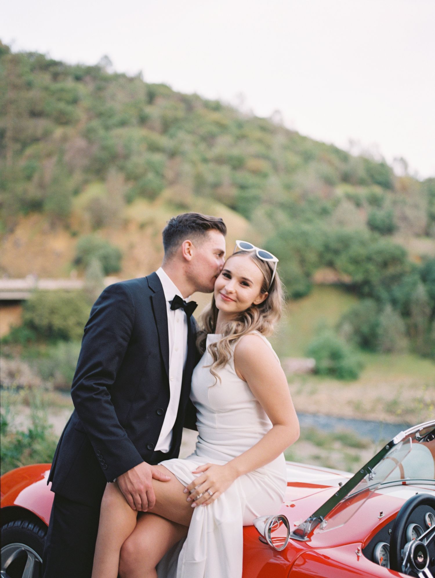 Bride and groom candid moment post-ceremony, warm film tones by Natalya Mark Photo.