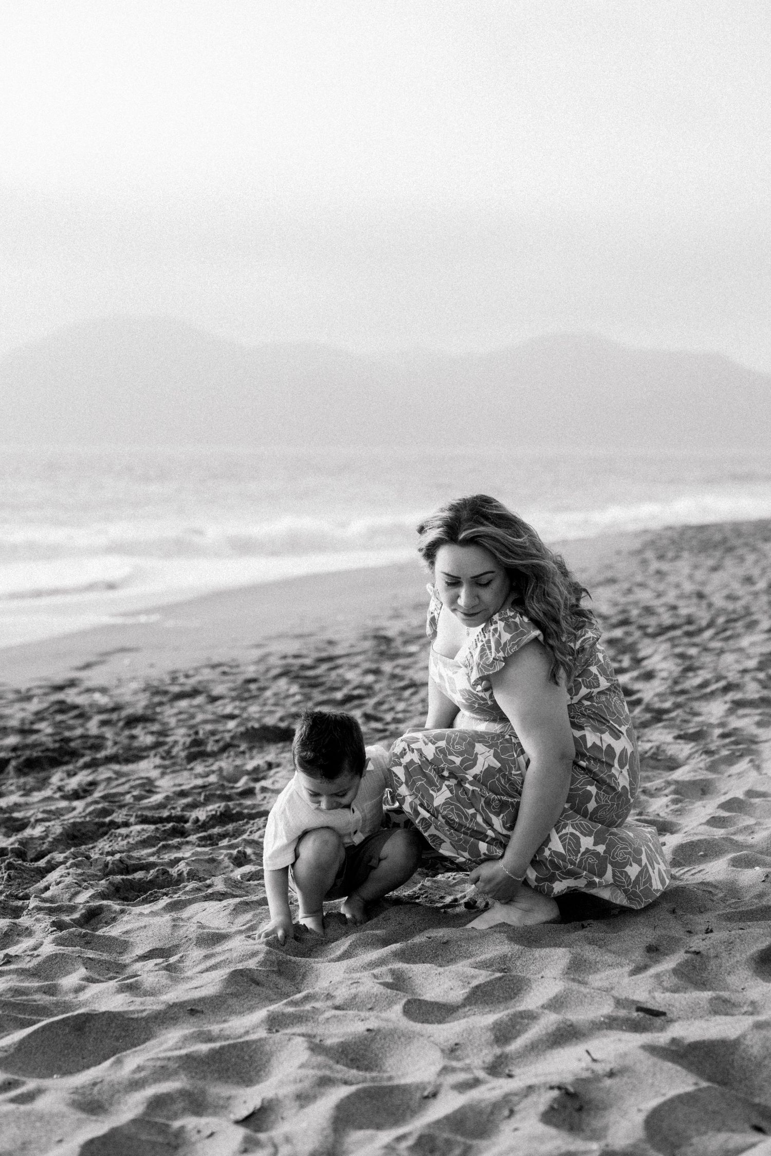 Mom and son playing on the sand in San Francisco