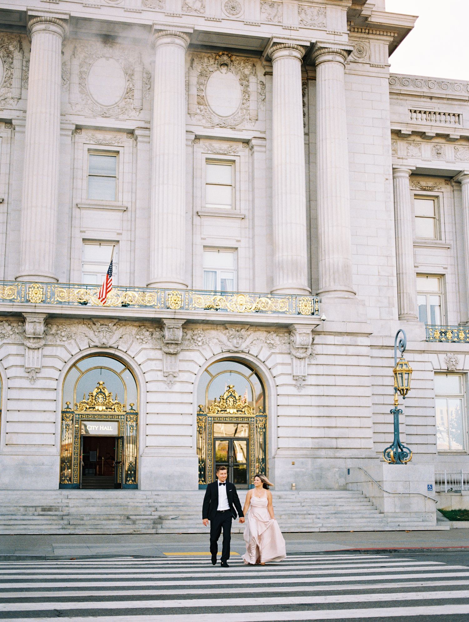 Bride and groom walking hand-in-hand at sunset, captured on 35mm film by Natalya Mark Photo.