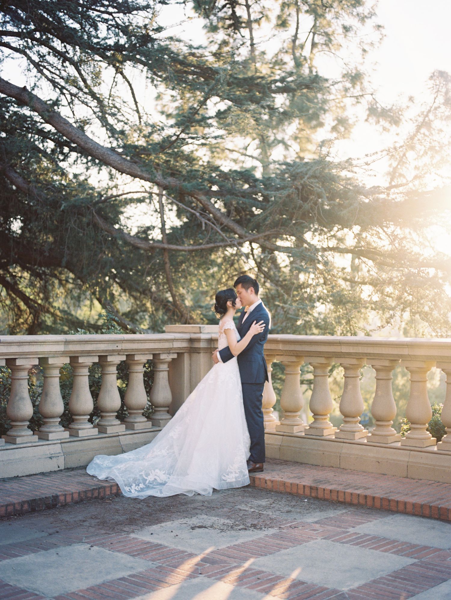 Bride and groom candid moment post-ceremony, warm film tones by Natalya Mark Photo.