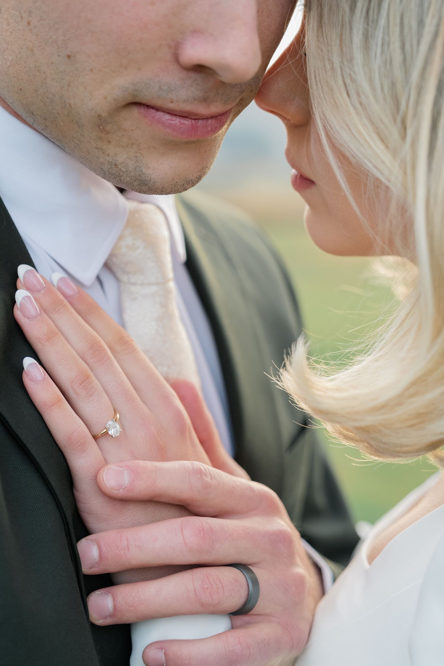 Close-up of wedding rings  by Natalya Mark Photo.