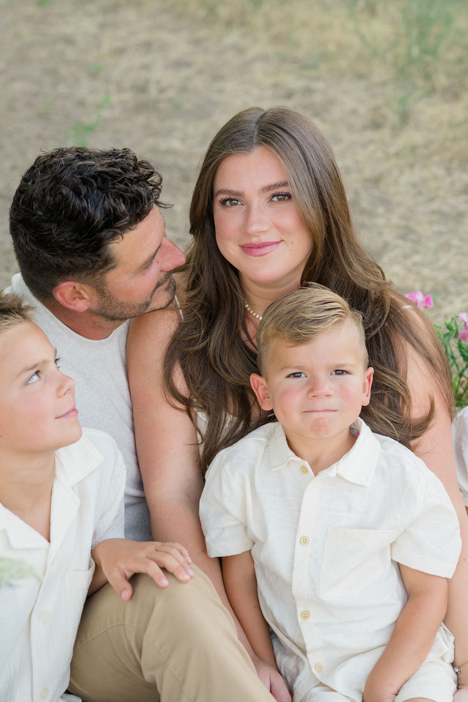 Outdoor lifestyle family photo in Boise with warm lighting and neutral outfits.