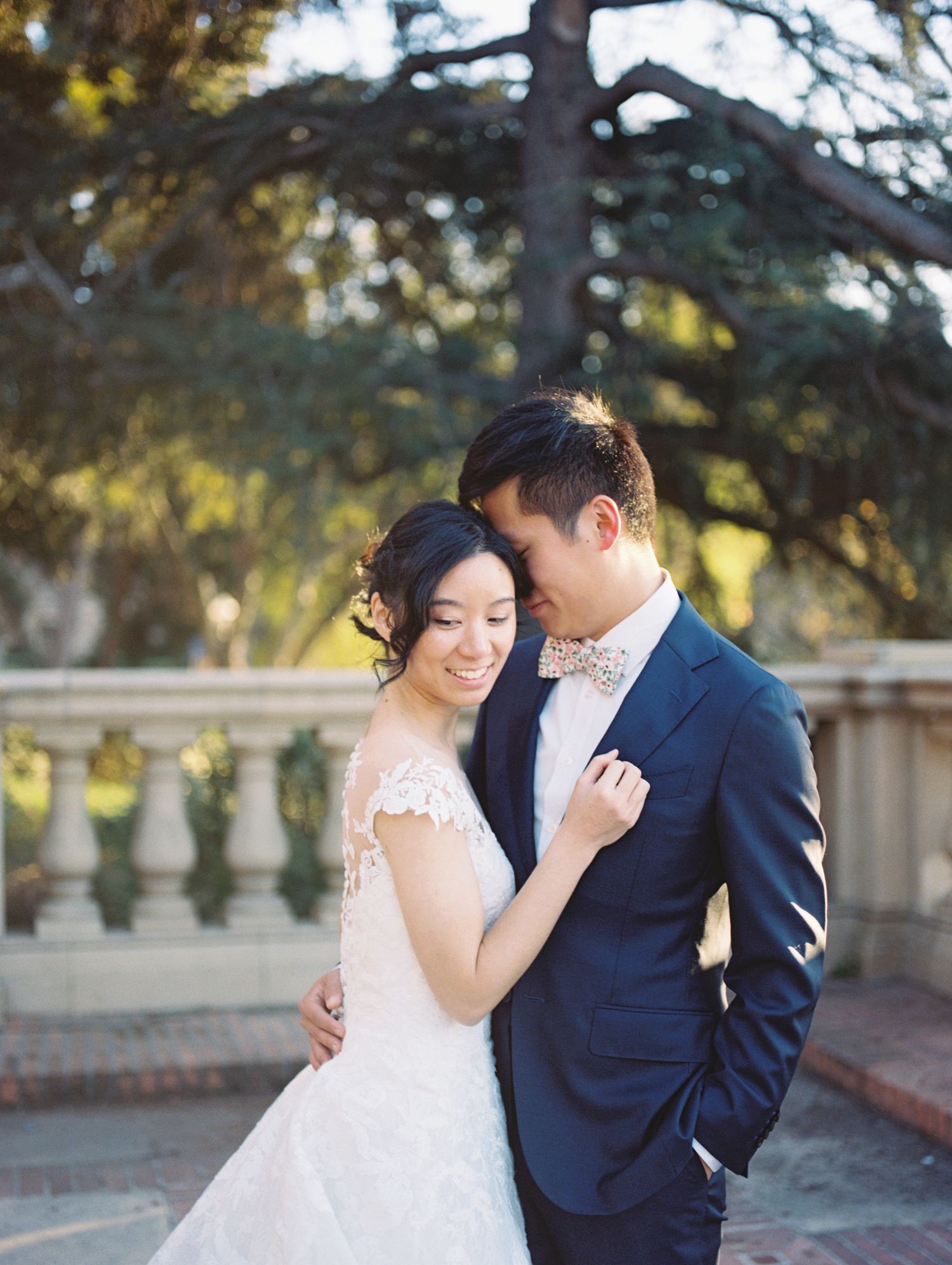 Bride and groom candid moment post-ceremony, warm film tones by Natalya Mark Photo.