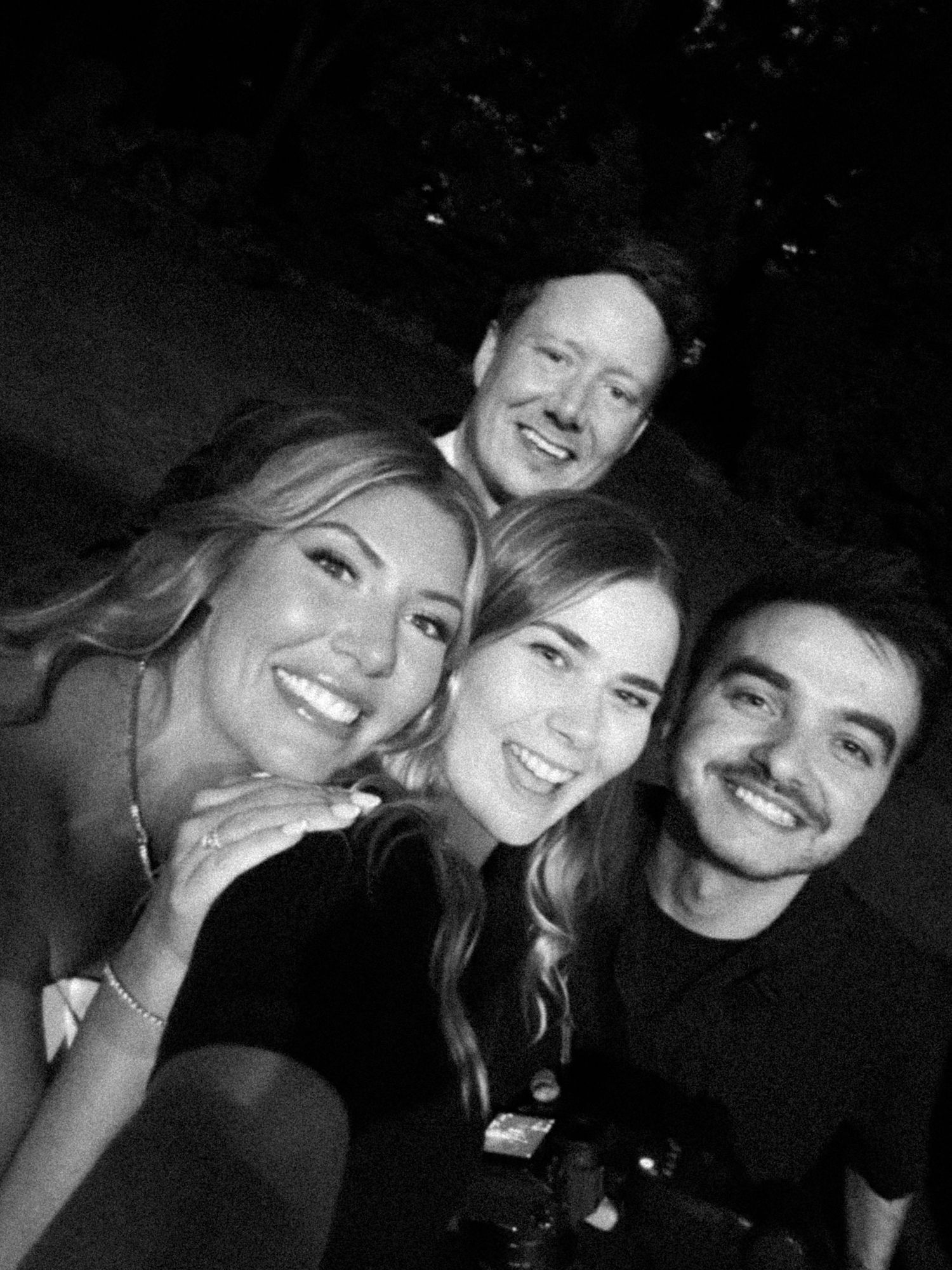 A series of black and white selfie photos showing friends posing together and smiling at the camera.