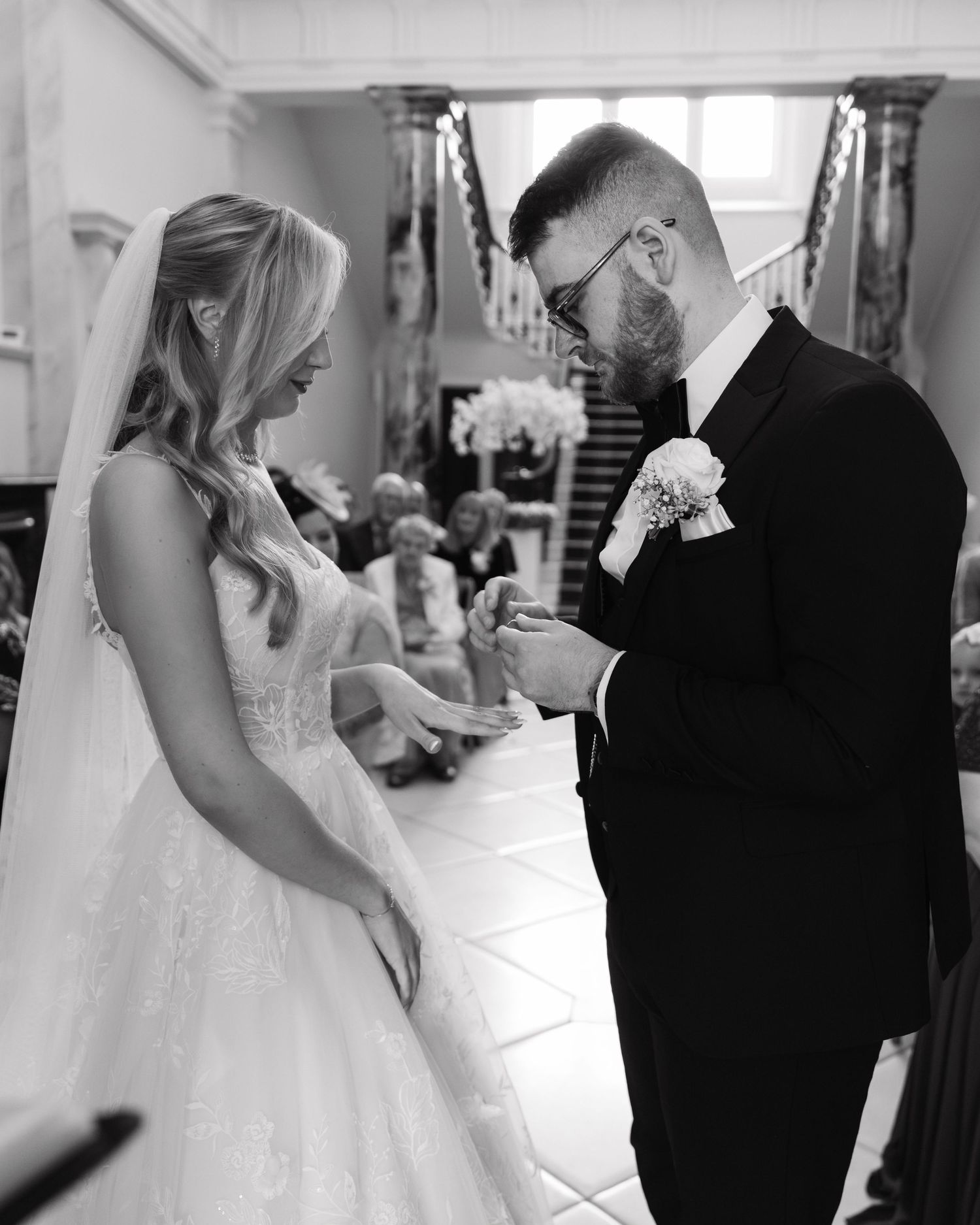 Black and white wedding photo series showing tender moments between bride and groom in various emotional scenes.