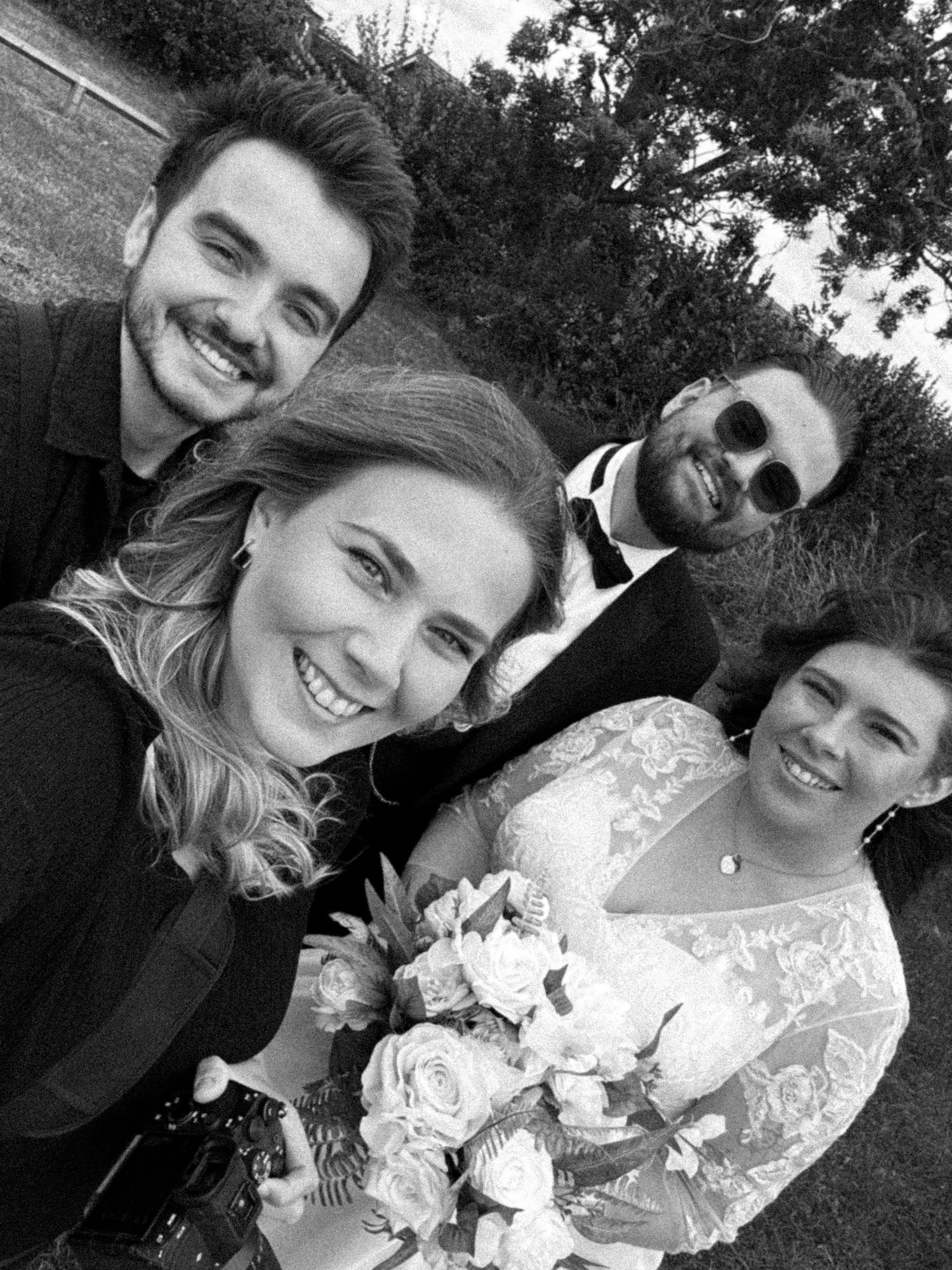 Black and white selfie photos showing people smiling together with white flowers and formal attire.