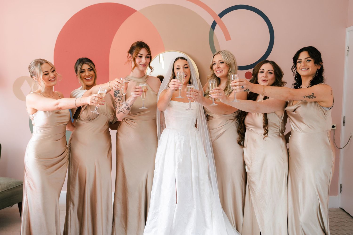 A group of bridesmaids in champagne-colored dresses pose together in a collage of wedding party photos.