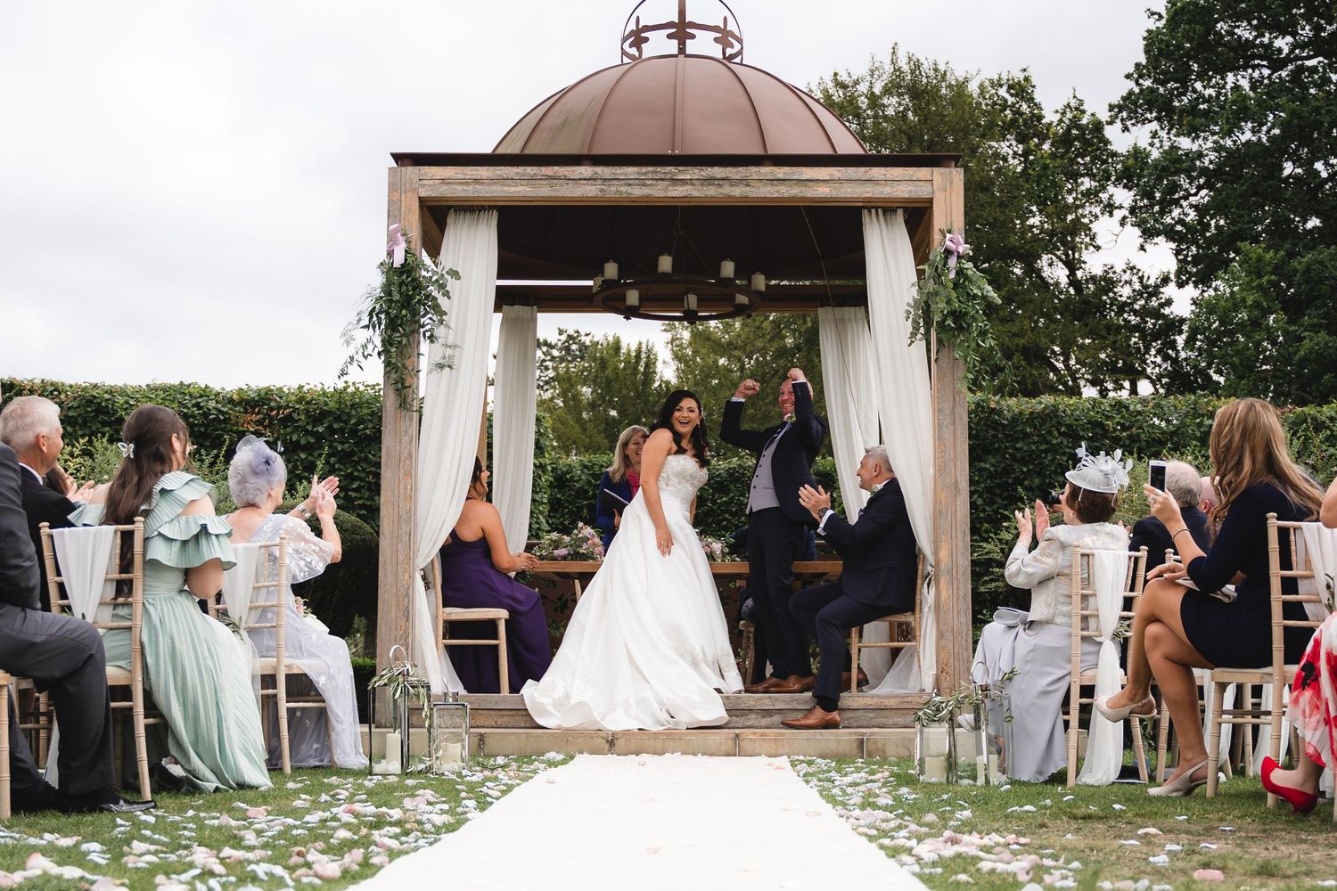 A series of outdoor wedding ceremony photos showing couples and guests gathered at a garden venue.