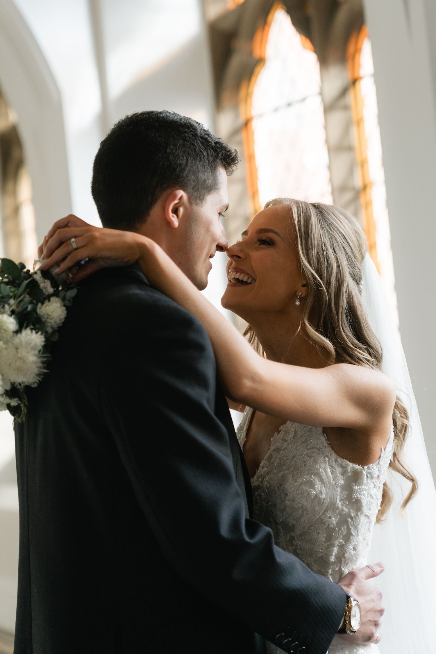 A romantic sequence of wedding photos showing a couple embracing in a sunlit room with white curtains.