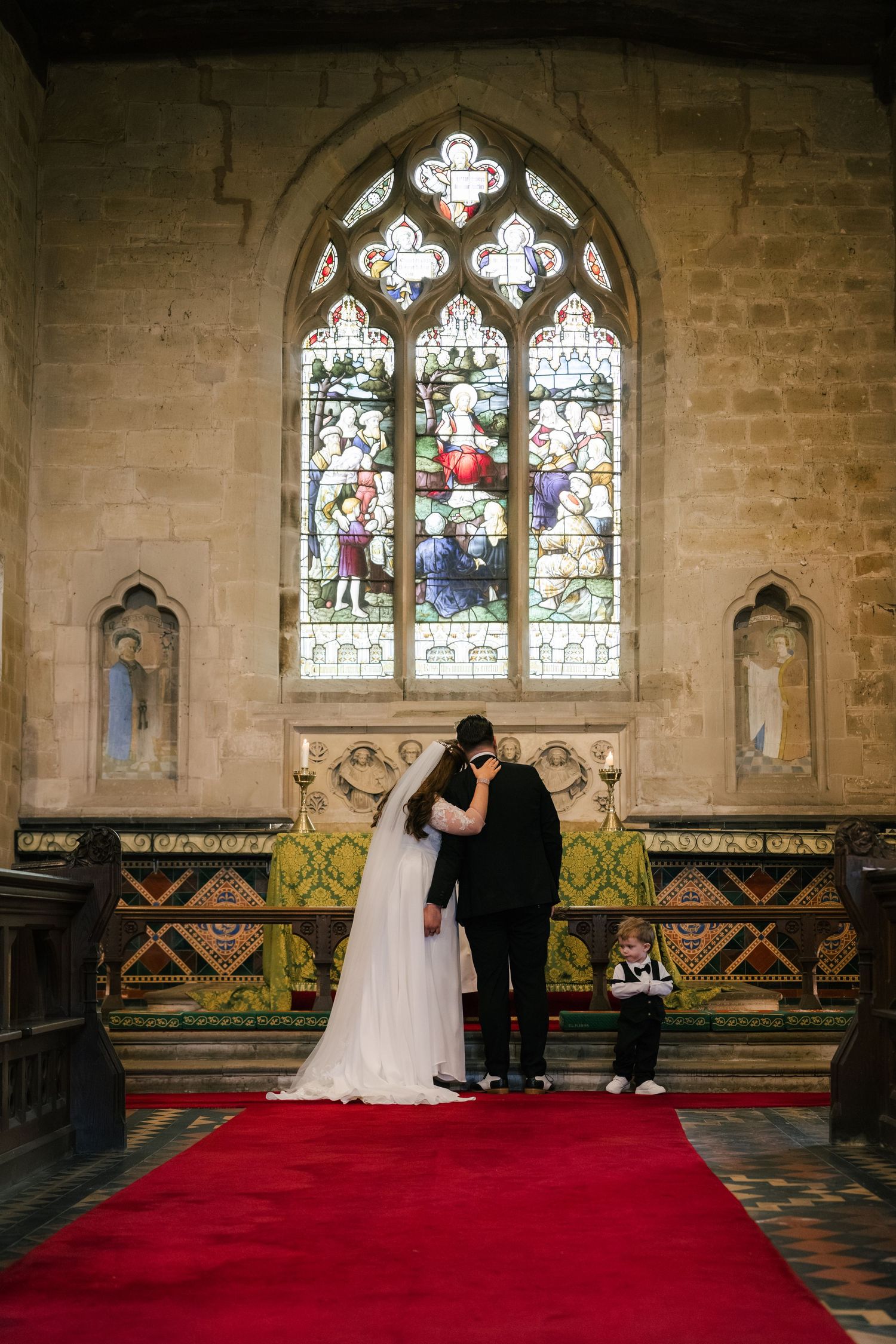 Elegant church wedding ceremony sequence showing couple at altar with stained glass windows and red carpet.