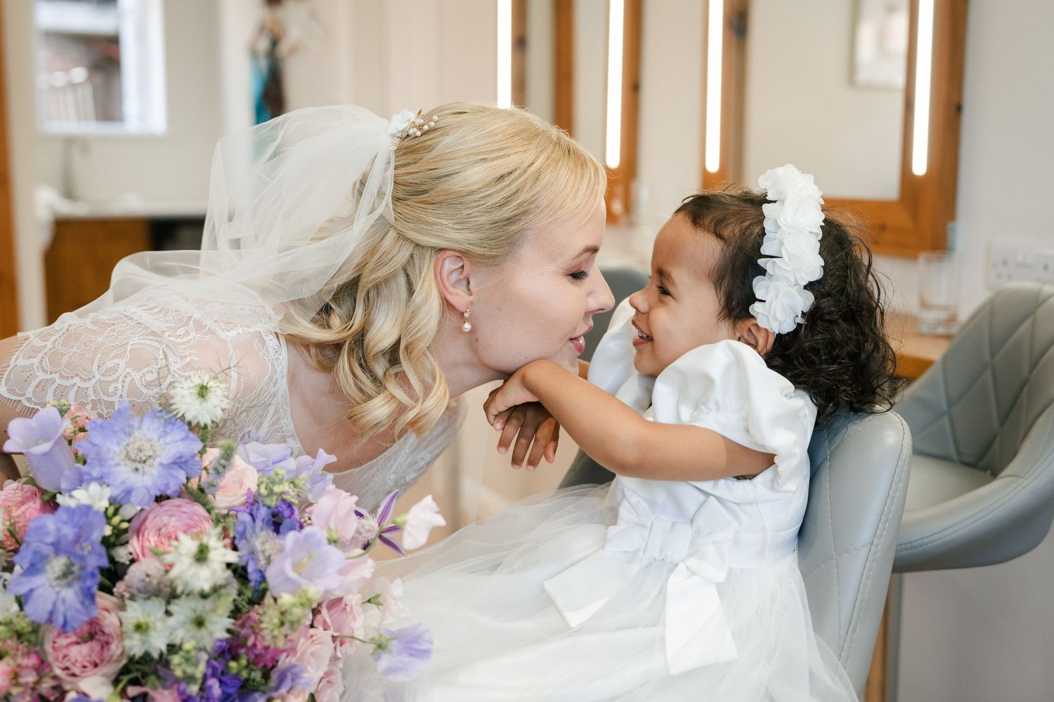 A bride and groom share intimate moments in a wedding photo collage featuring pastel floral arrangements.