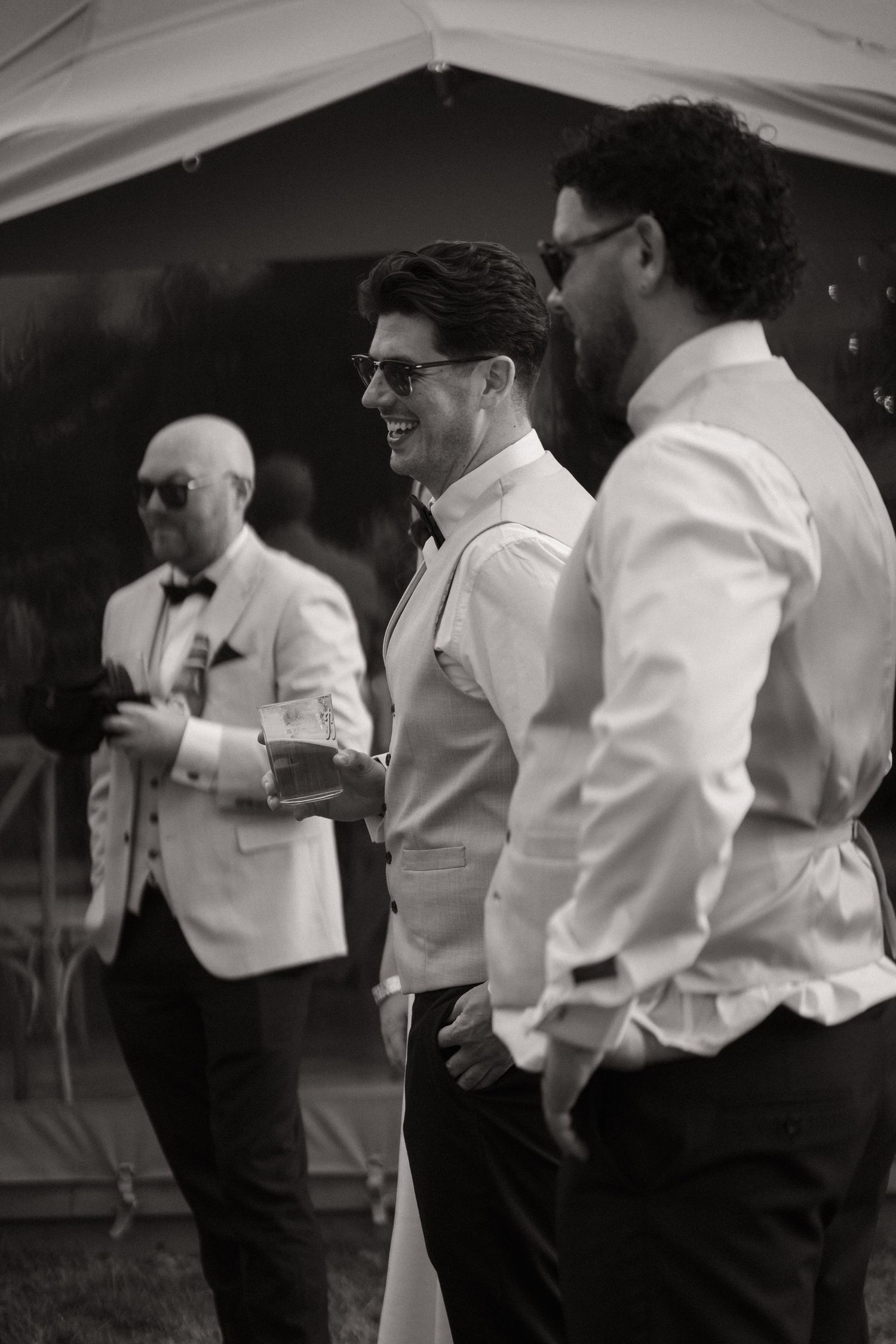 A series of black and white photos showing people in formal attire dancing at what appears to be a social gathering.