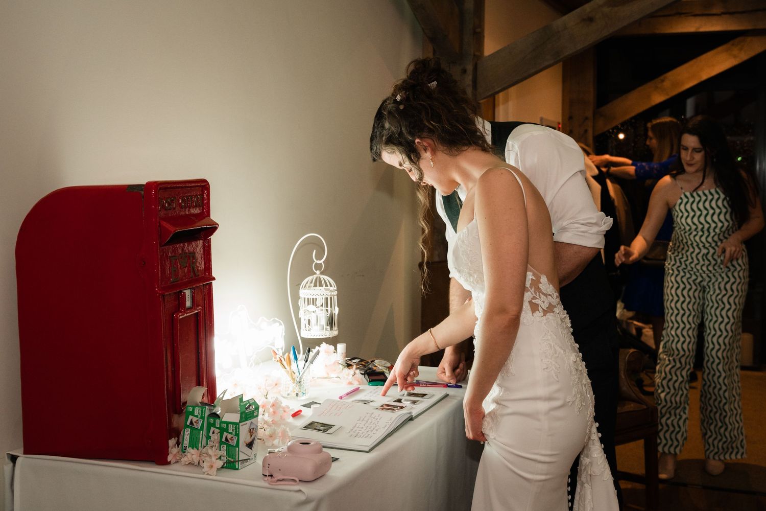 A series of wedding preparation photos showing dress fittings and getting ready moments in a rustic venue.