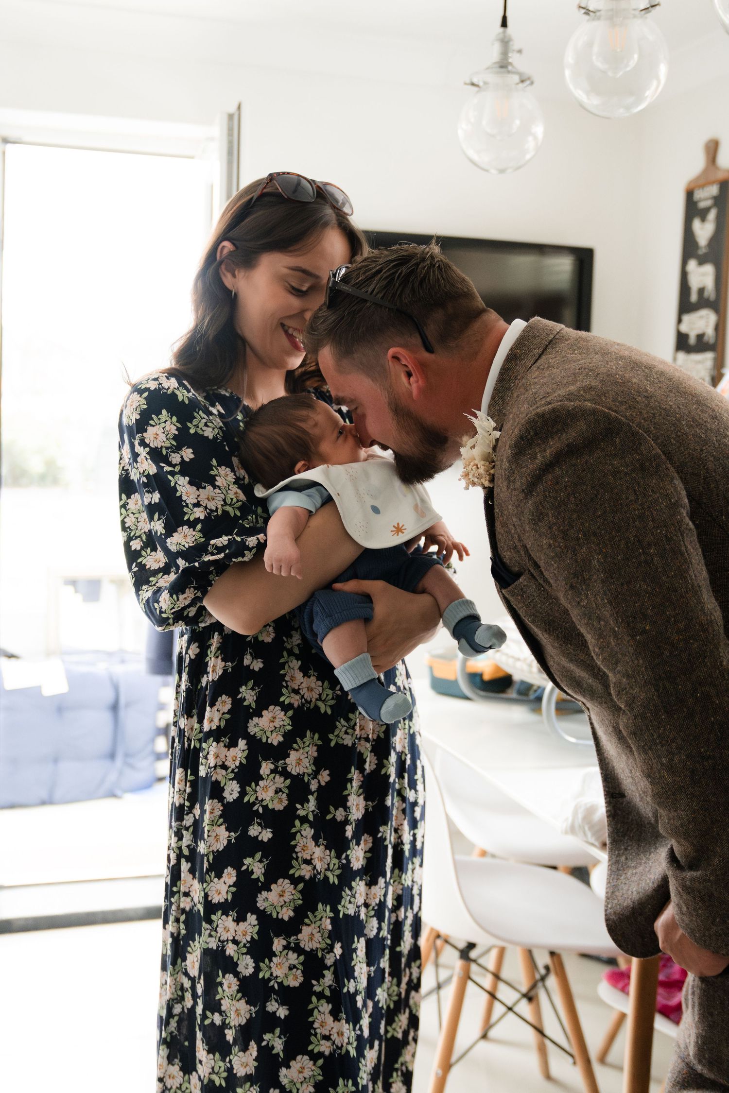 A tender family moment captured in a series of four progressive photos showing affectionate interaction at home.