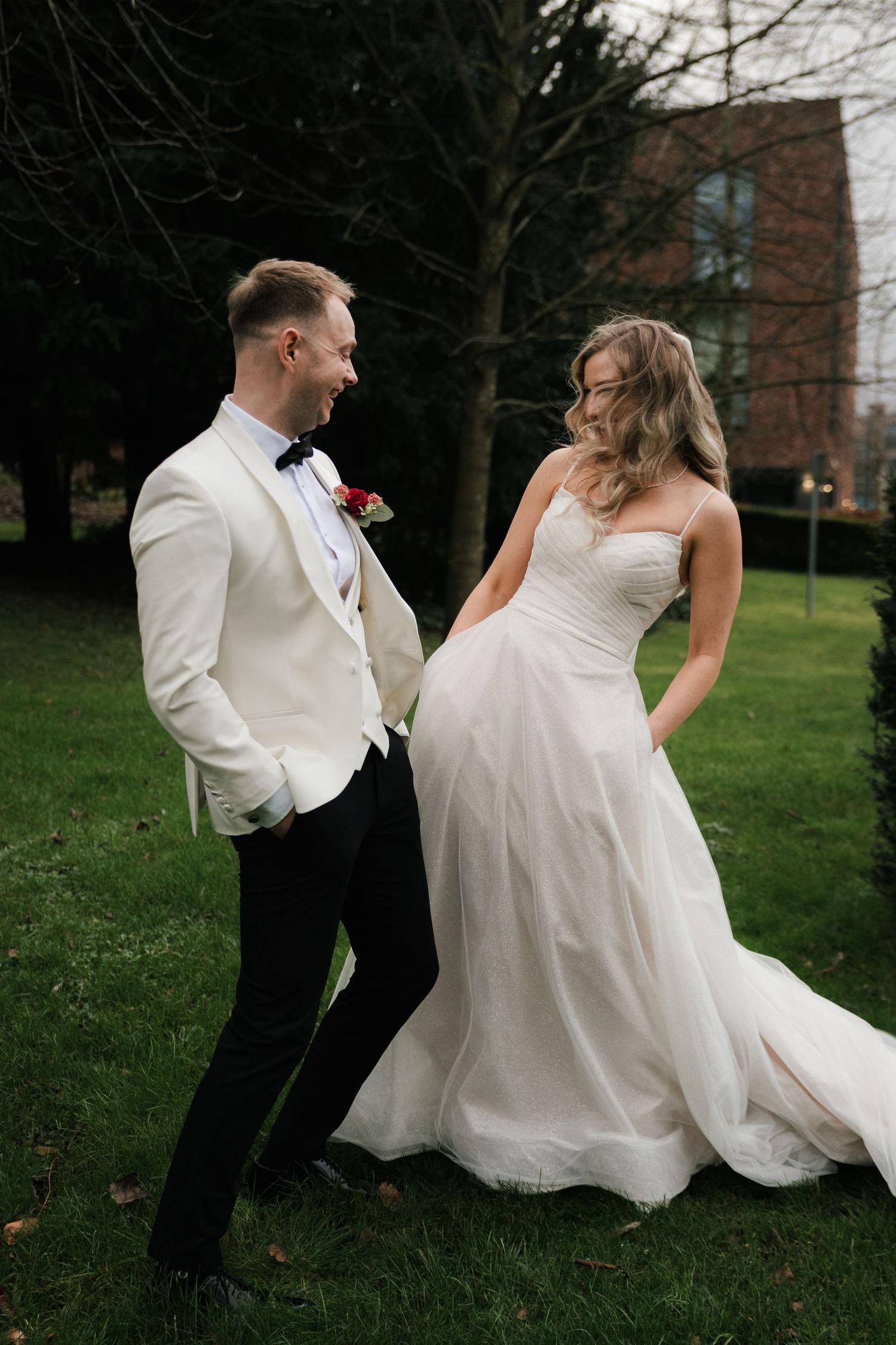 A romantic wedding photo sequence shows a couple playfully falling onto grass together in their formal attire.