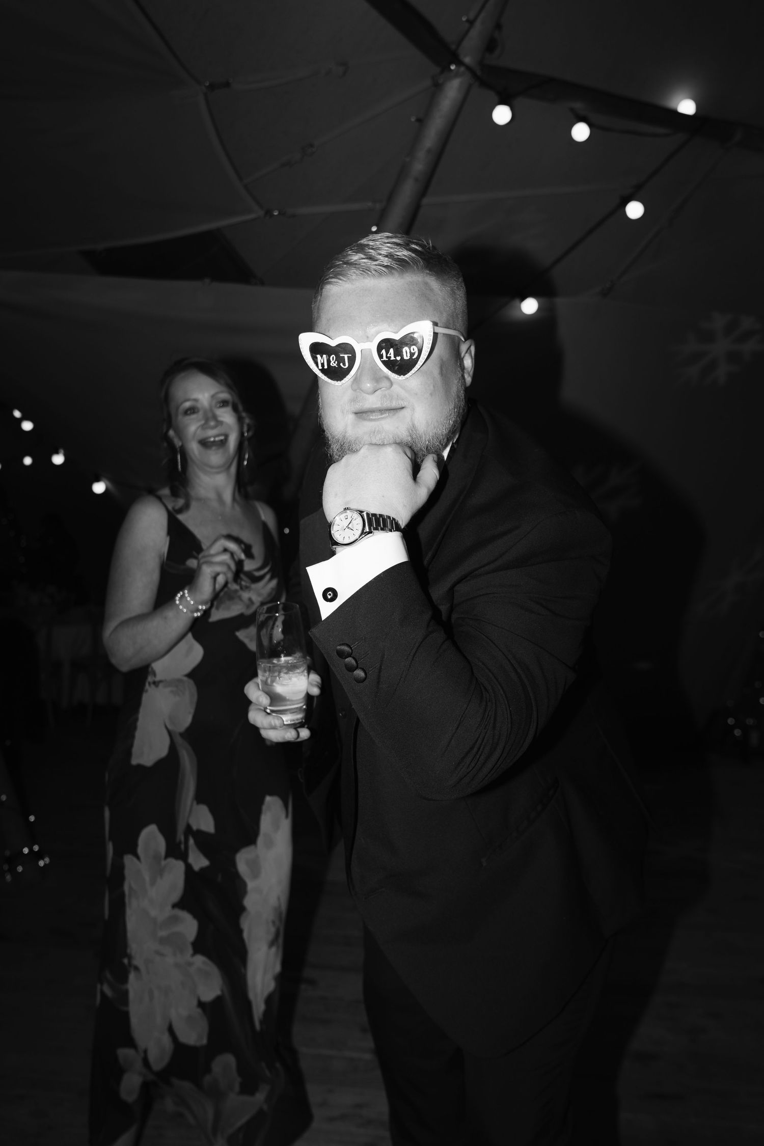 Black and white party photos show people dancing and socializing at a dimly lit nightclub event.