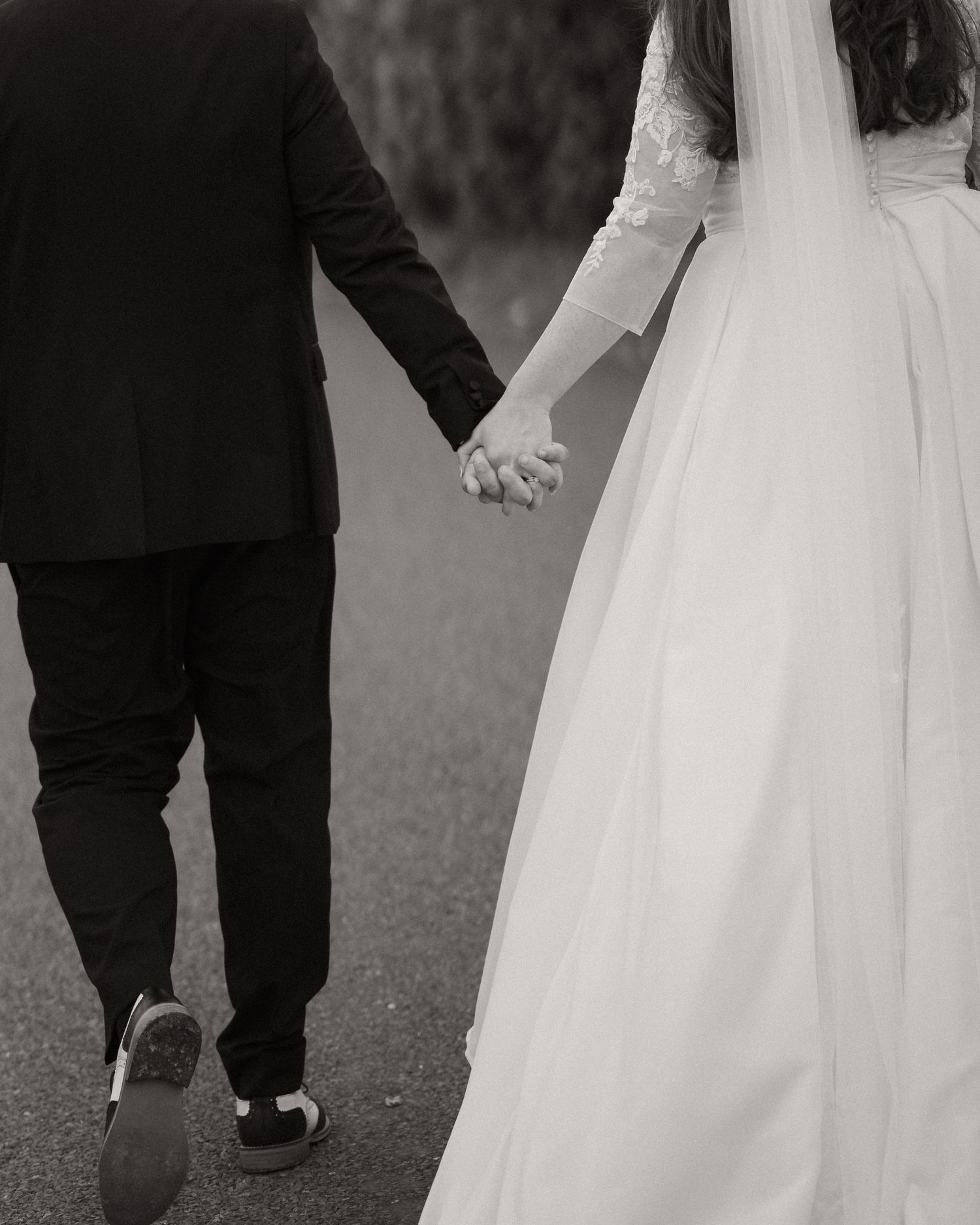 A black and white series of cropped wedding photos showing the couple's feet and lower portions of their formal attire.