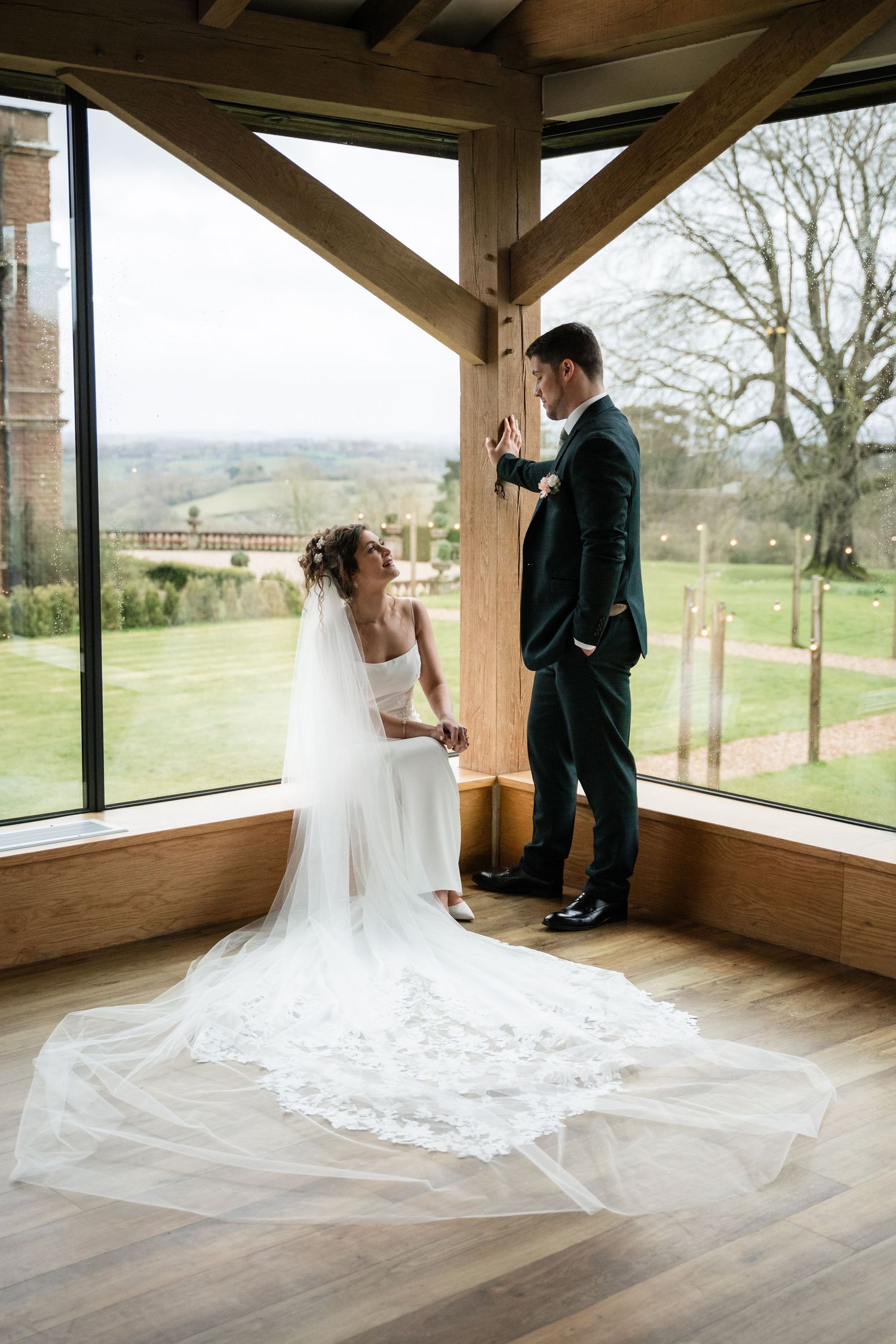 A series of wedding photos showing a couple in an elegant wooden gazebo overlooking scenic countryside views.