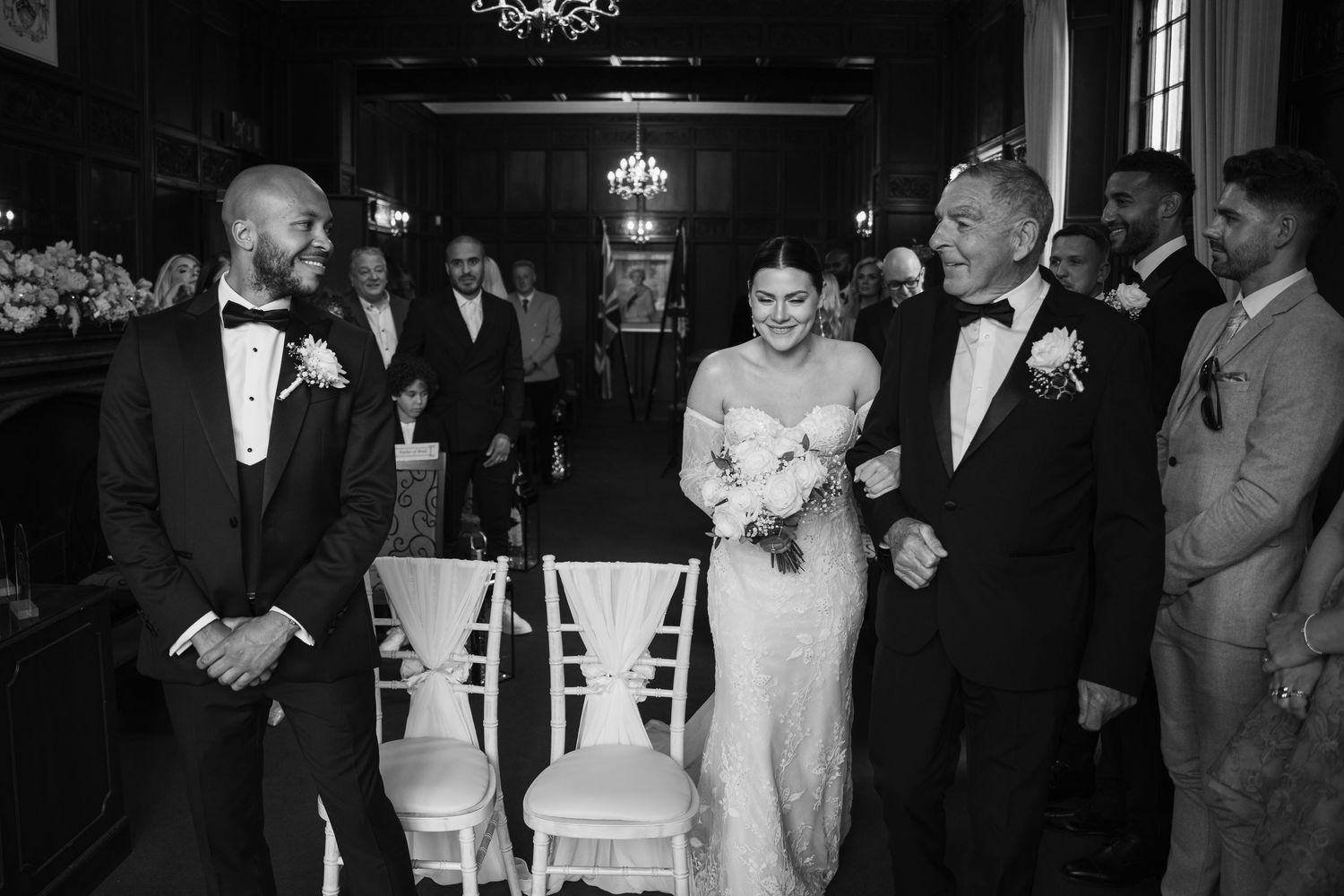 Black and white photo collage showing emotional moments during a wedding ceremony and reception.