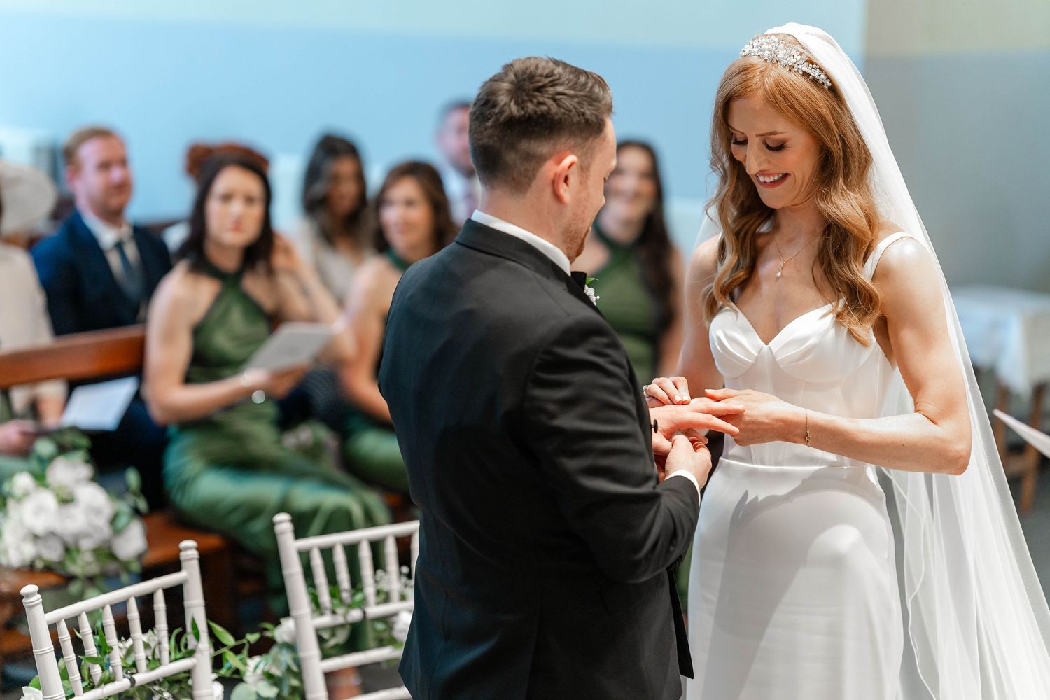 Wedding ceremony moments captured in bright church setting with blue accents.
