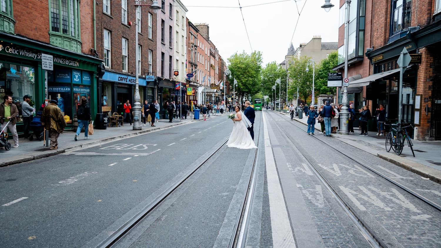 Urban street view of historic Dublin with brick buildings and pedestrians.