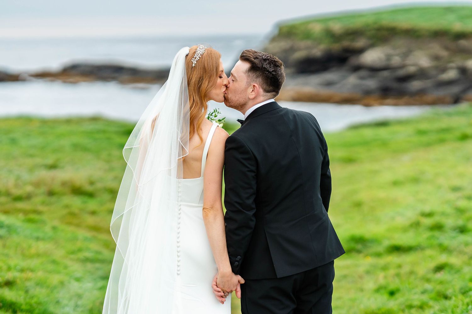 Romantic wedding portraits captured against the backdrop of Ireland's stunning coastal scenery.