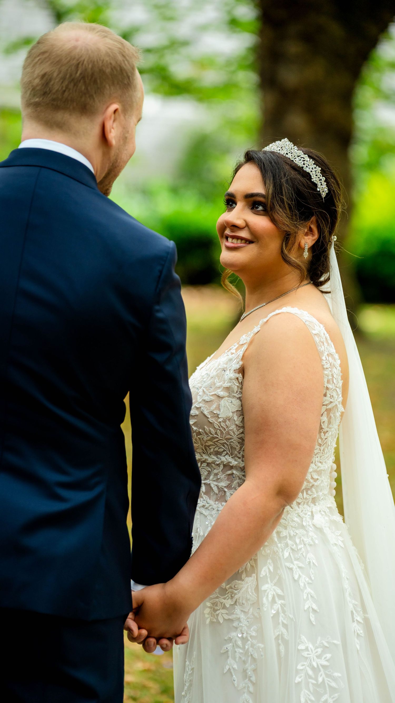 A couple shares joyful moments during their autumn wedding photoshoot.