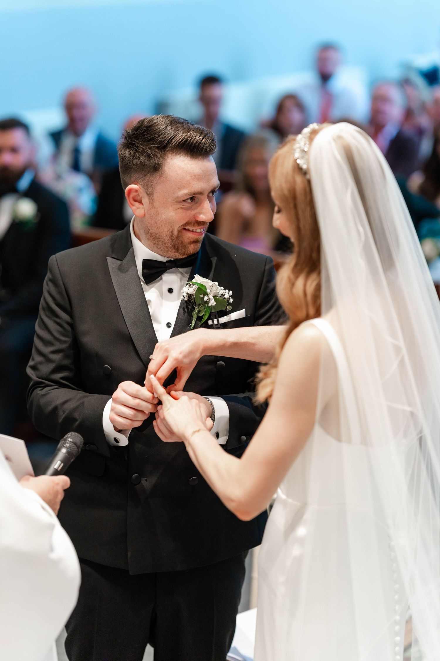 Couple sharing a joyful moment during their wedding ceremony.