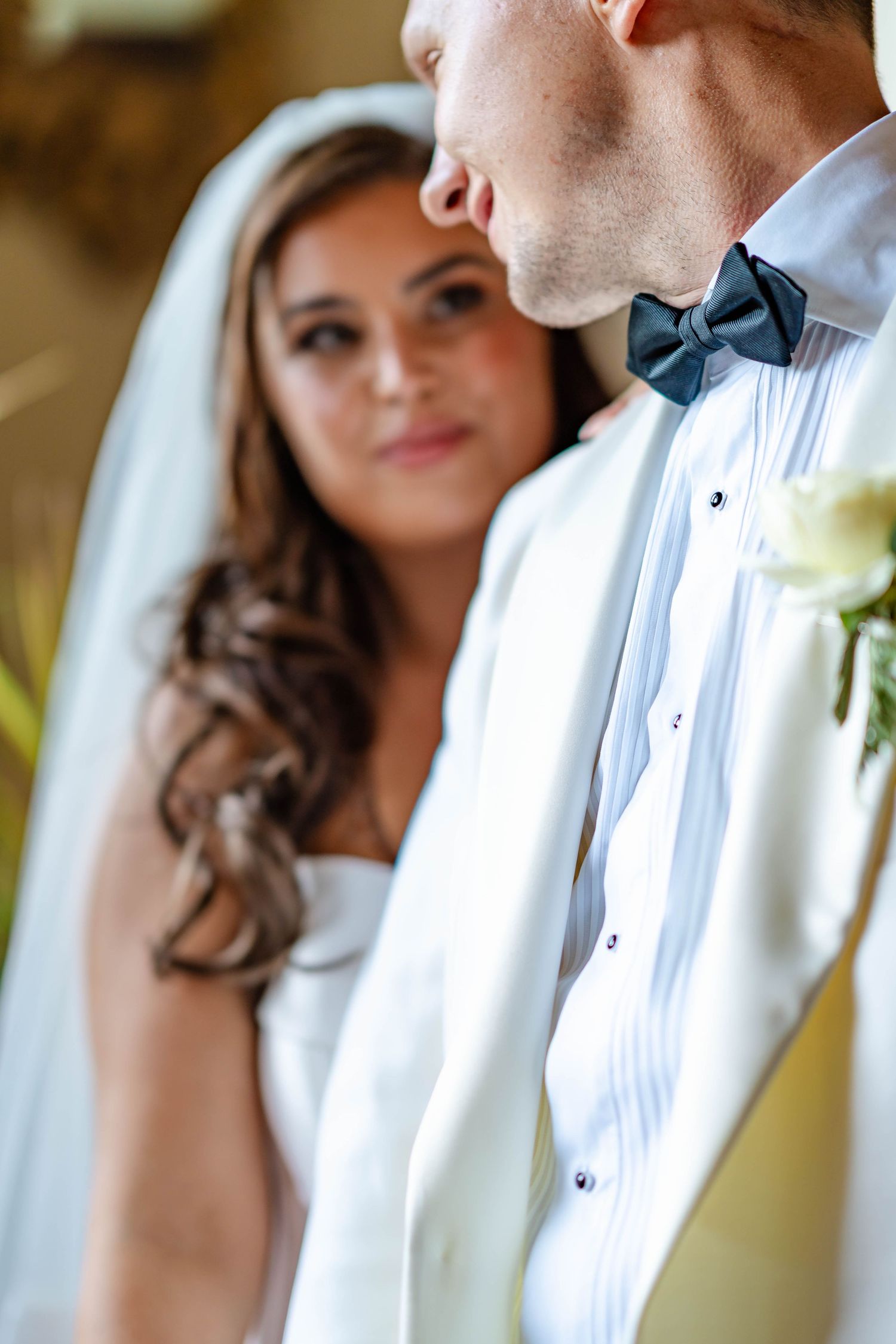 Close-up wedding portrait series showing romantic moments between bride and groom in traditional formal attire.
