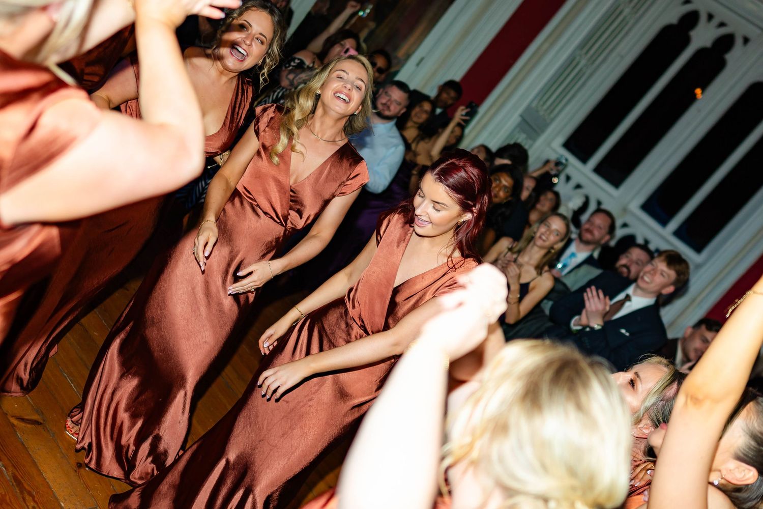People dancing and enjoying themselves at a lively party celebration.