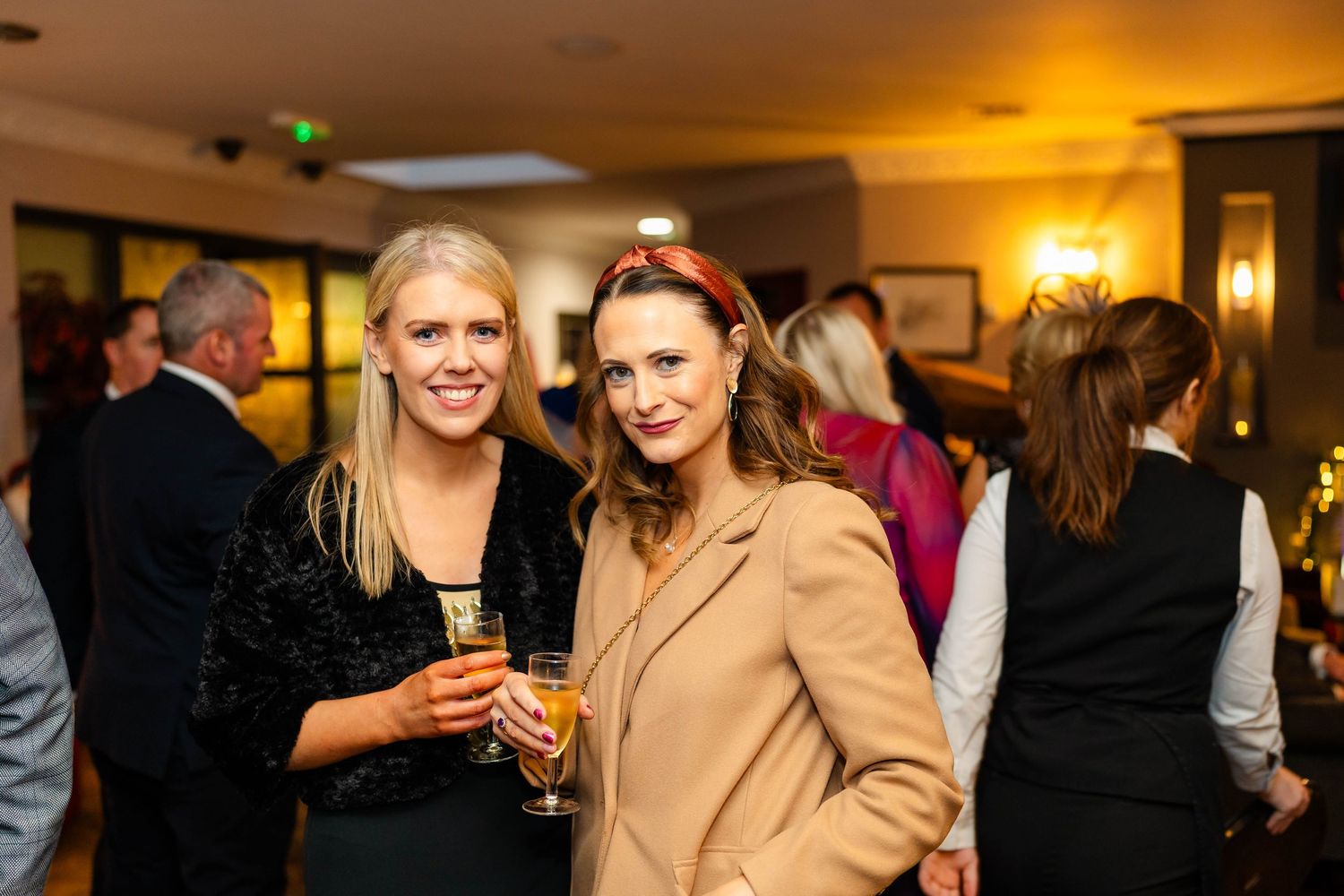 Indoor celebration event with warm lighting and festive atmosphere.