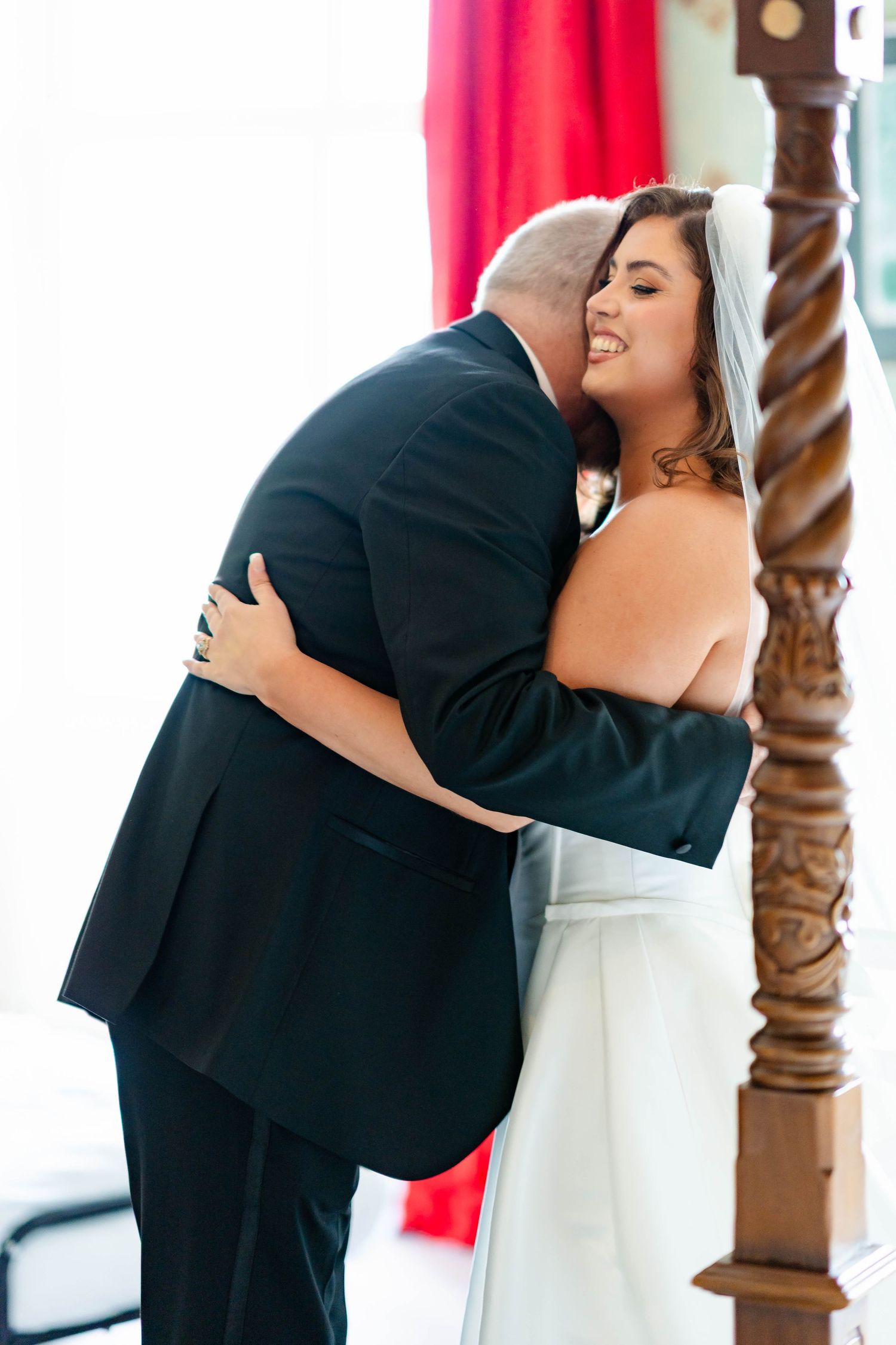 A series of four progressive photos showing a tender first look moment between newlyweds at their wedding ceremony.