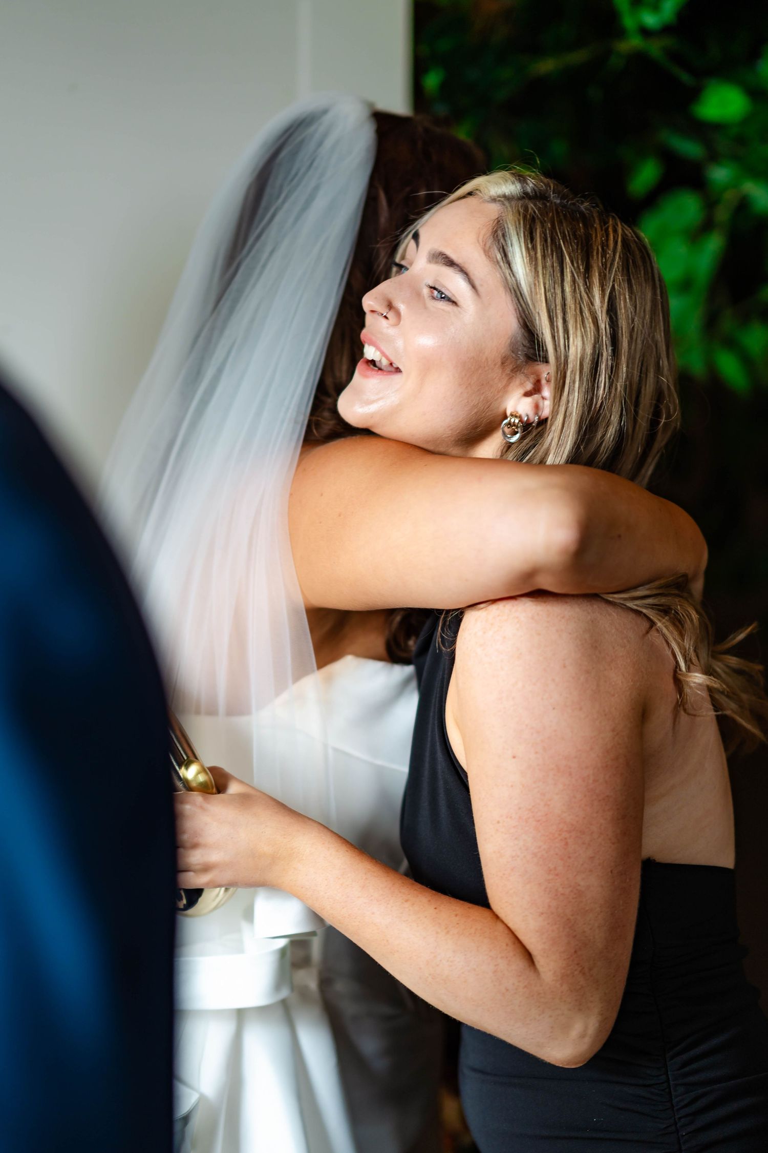 A series of candid emotional moments showing two people embracing in formal attire at what appears to be a wedding celebration.
