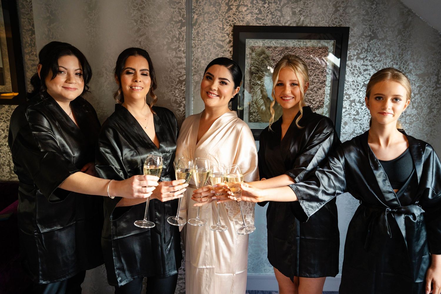Friends gathered together raising glasses in celebration.