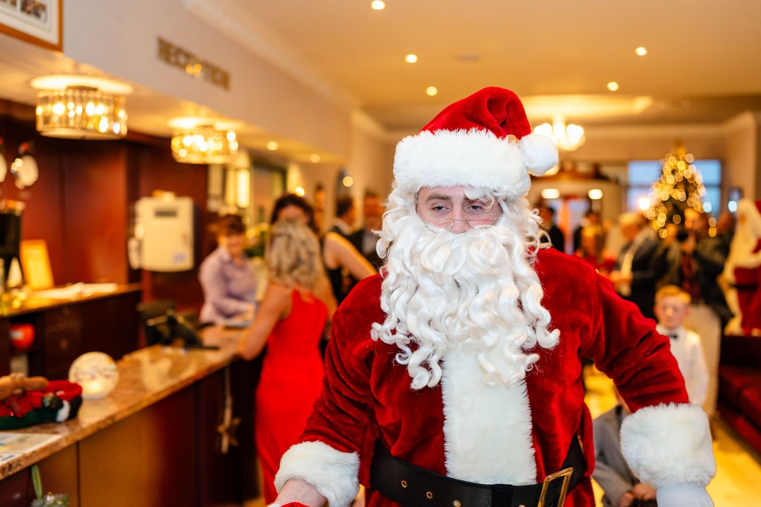 Holiday celebration with festive decorations and traditional Christmas characters in warm indoor lighting.