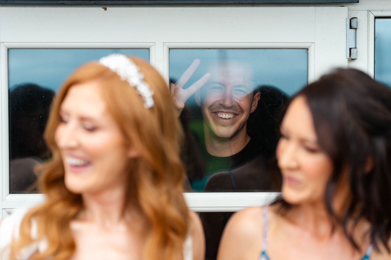 Group celebrating at an outdoor event with bright smiles.