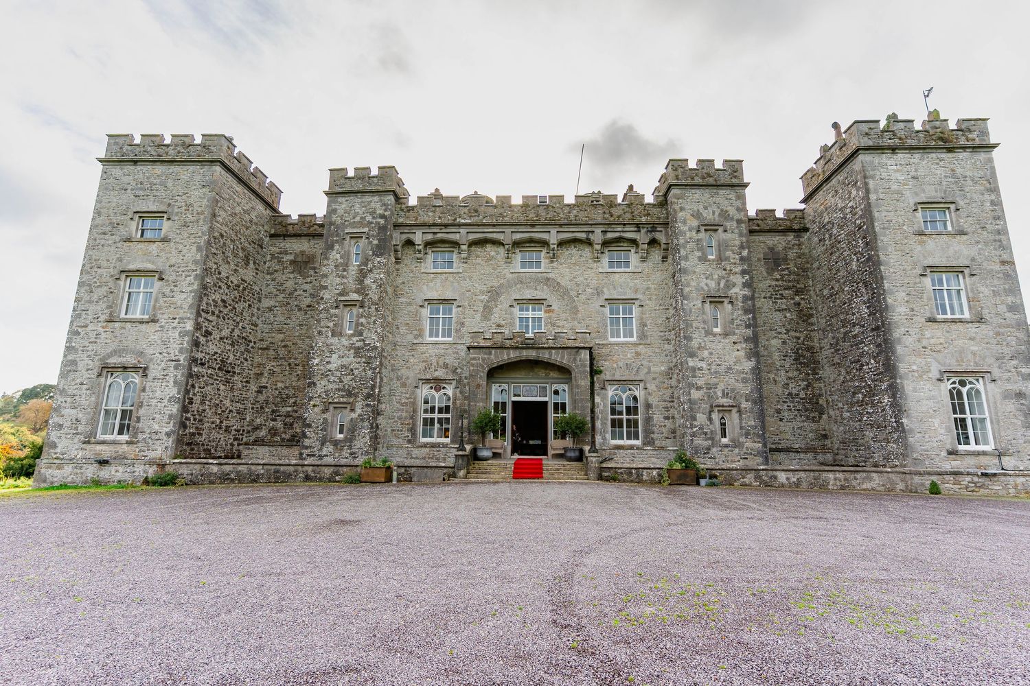 A panoramic sequence showing multiple angles of a historic stone castle with gray walls and battlements in Ireland.