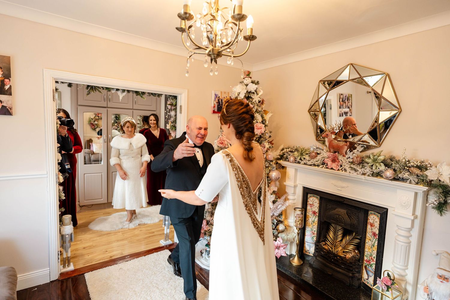 Bridal preparation room with floral decorations and elegant lighting fixtures.