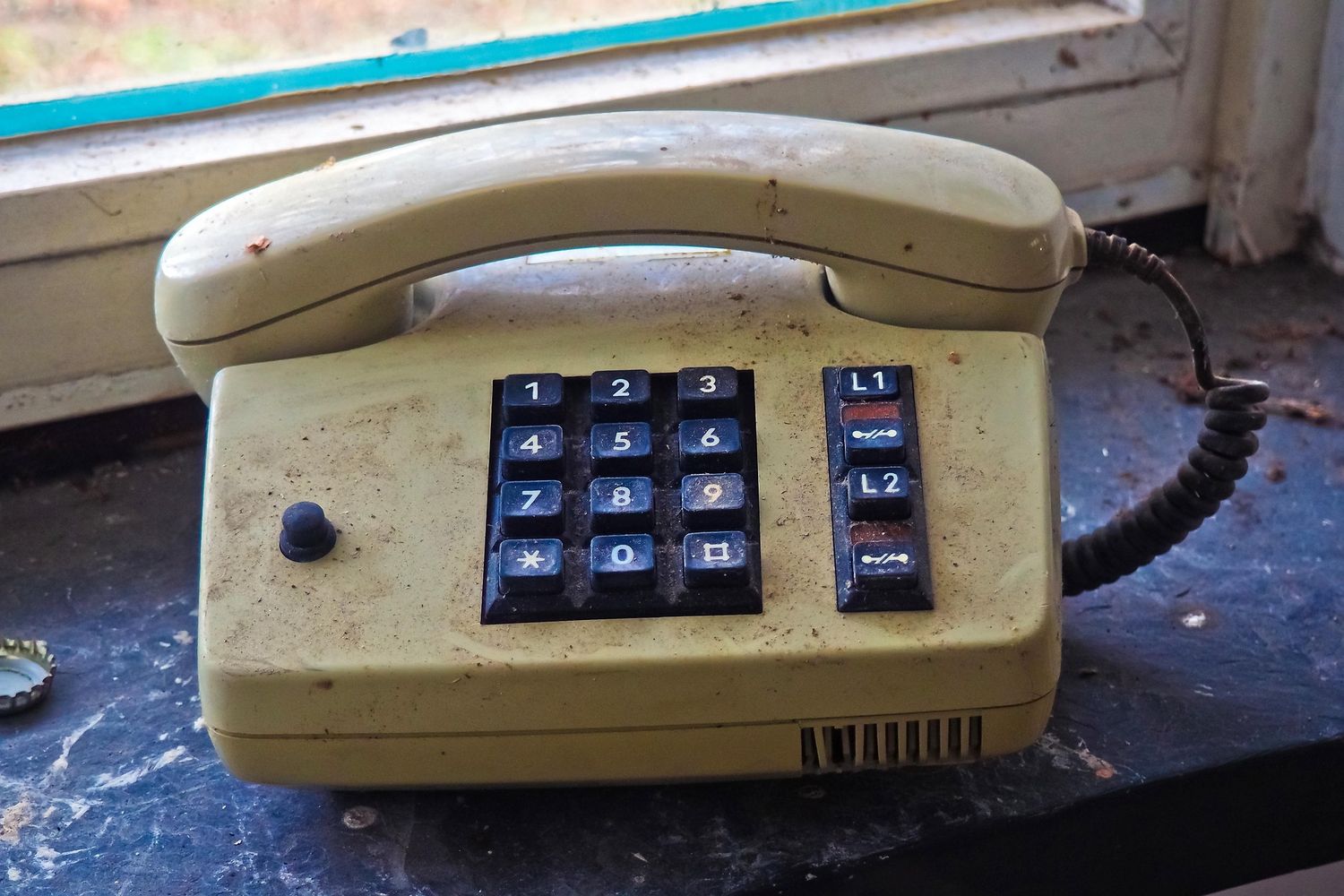 Vintage phone on desk representing communication or booking