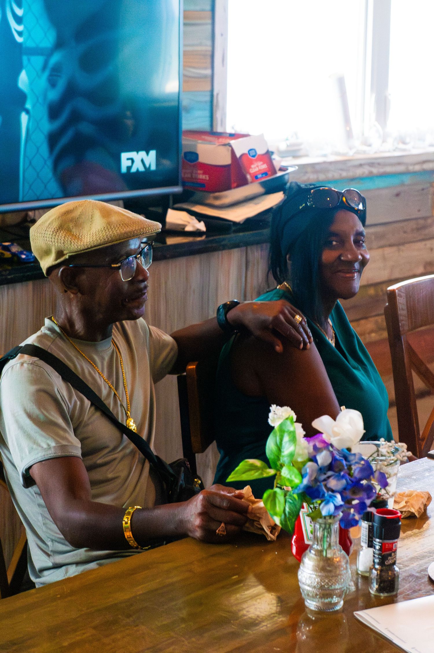 Parents of the couple smiling during the reception