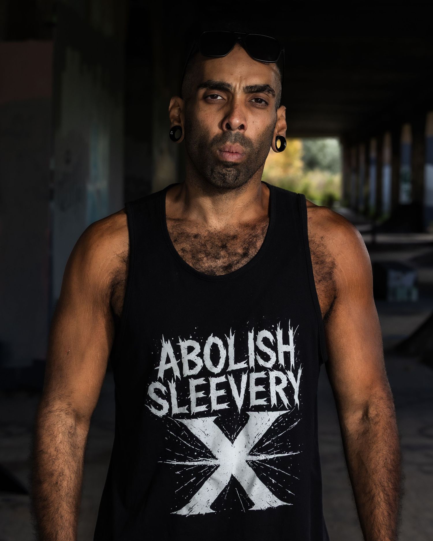 A person wearing a black tank top with 