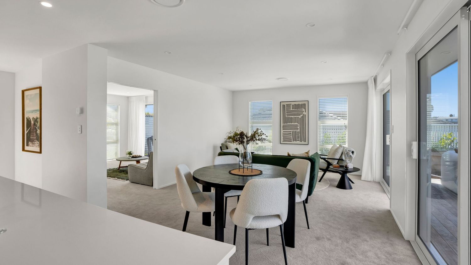 360-degree panoramic view of modern white interior with ocean views.