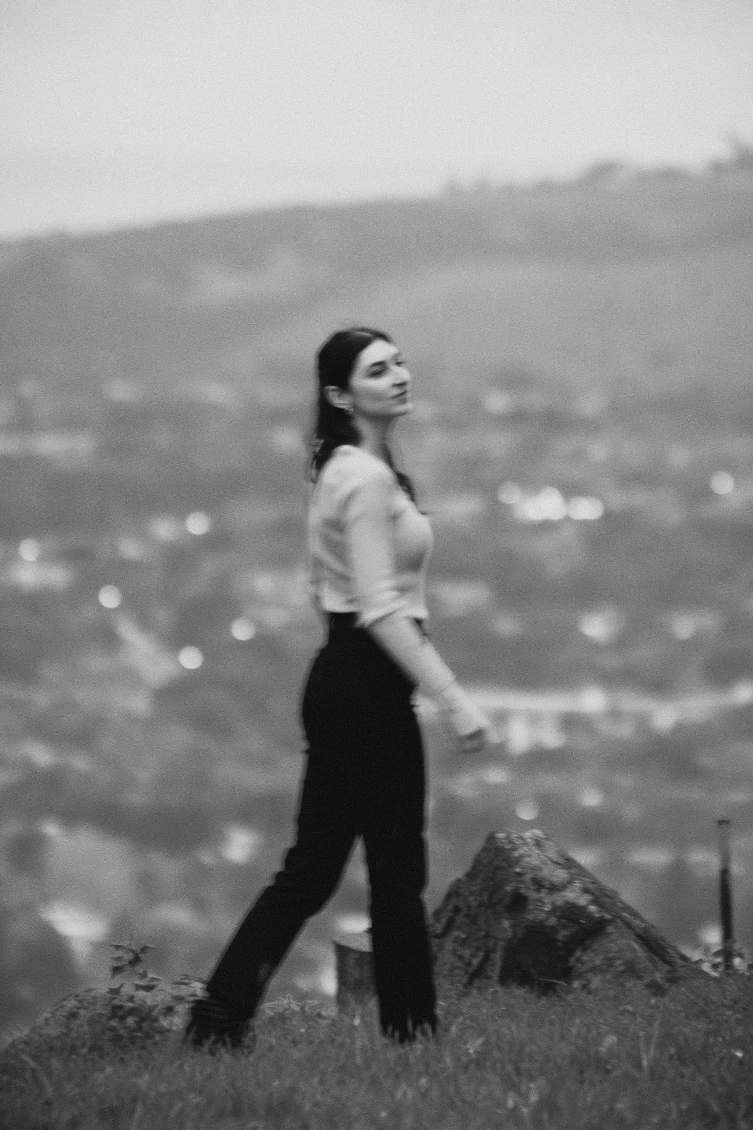 Black and white portrait of a woman at dusk with bokeh city lights at Franceschi Park Santa Barbara portrait photographer, Herics Photo